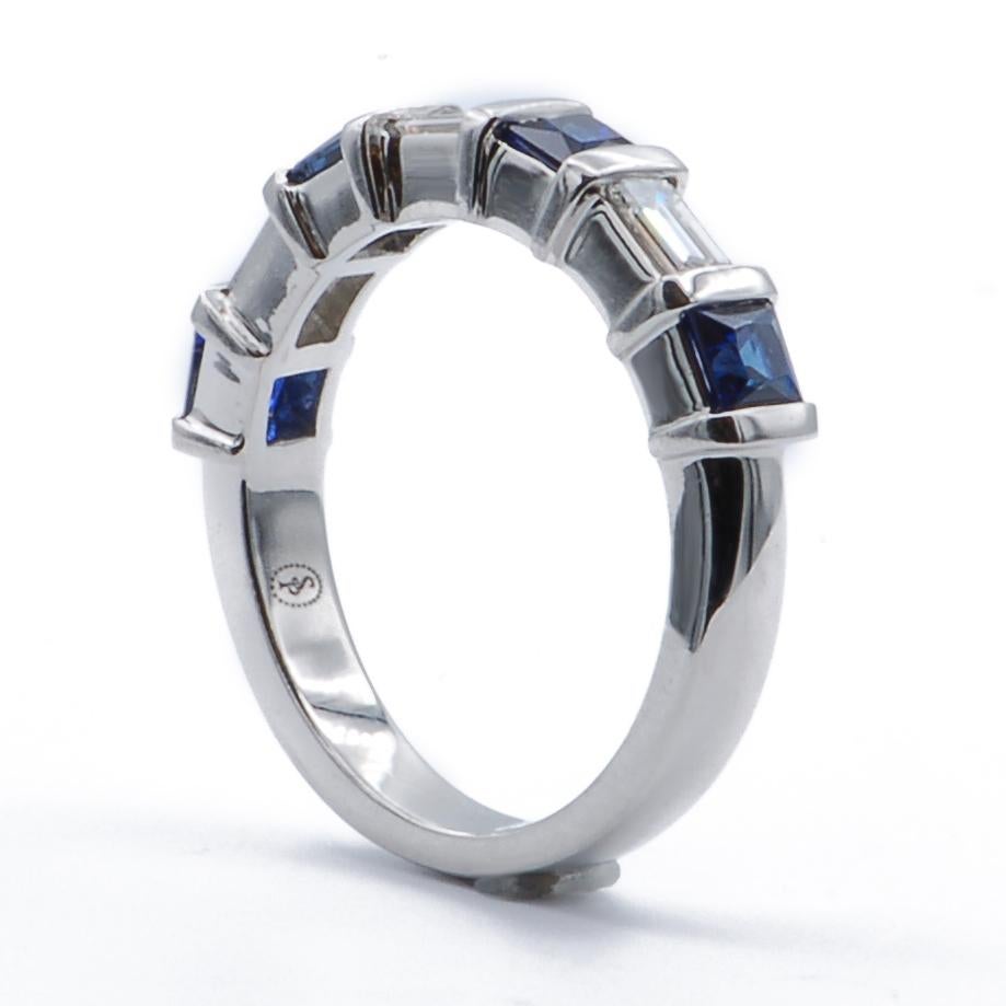 This elegant platinum band ring features three diamonds baguettes, alternating with four square sapphires which are all bar set. The band has a domed finish which makes it comfortable on the finger. 

0.43 Carats Diamonds
0.85 Carats Sapphires
Ring