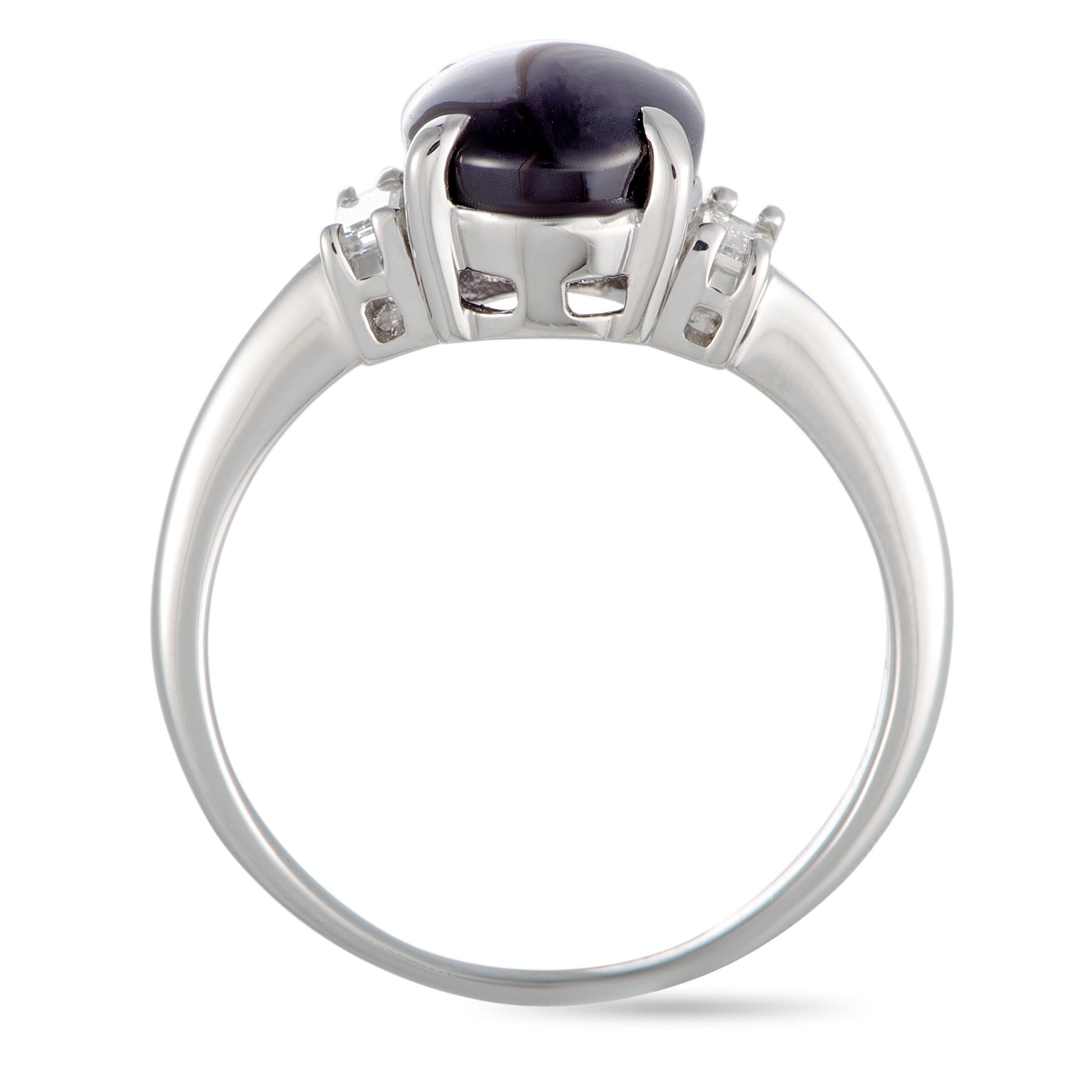 This ring is made of platinum and weighs 5.9 grams, boasting band thickness of 2 mm and top height of 6 mm, while top dimensions measure 10 by 12 mm. The ring is set with a purple sapphire that weighs 4.83 carats and with diamonds that total 0.24