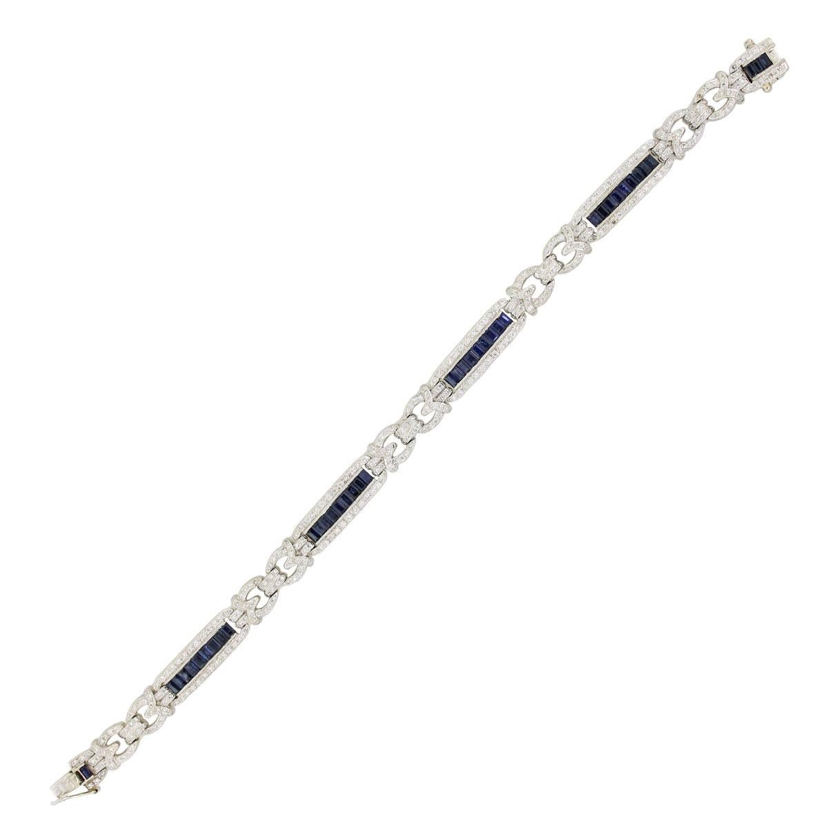 Material: 14k white gold
Diamond Details: Approximately 1.90ctw of round brilliant diamonds. Diamonds are G/H in color and SI in clarity.
Gemstone Details: Approximately 1ctw of emerald shape sapphires.
Measurements: 7.50″ 0.14″ x 0.29″
Clasp: