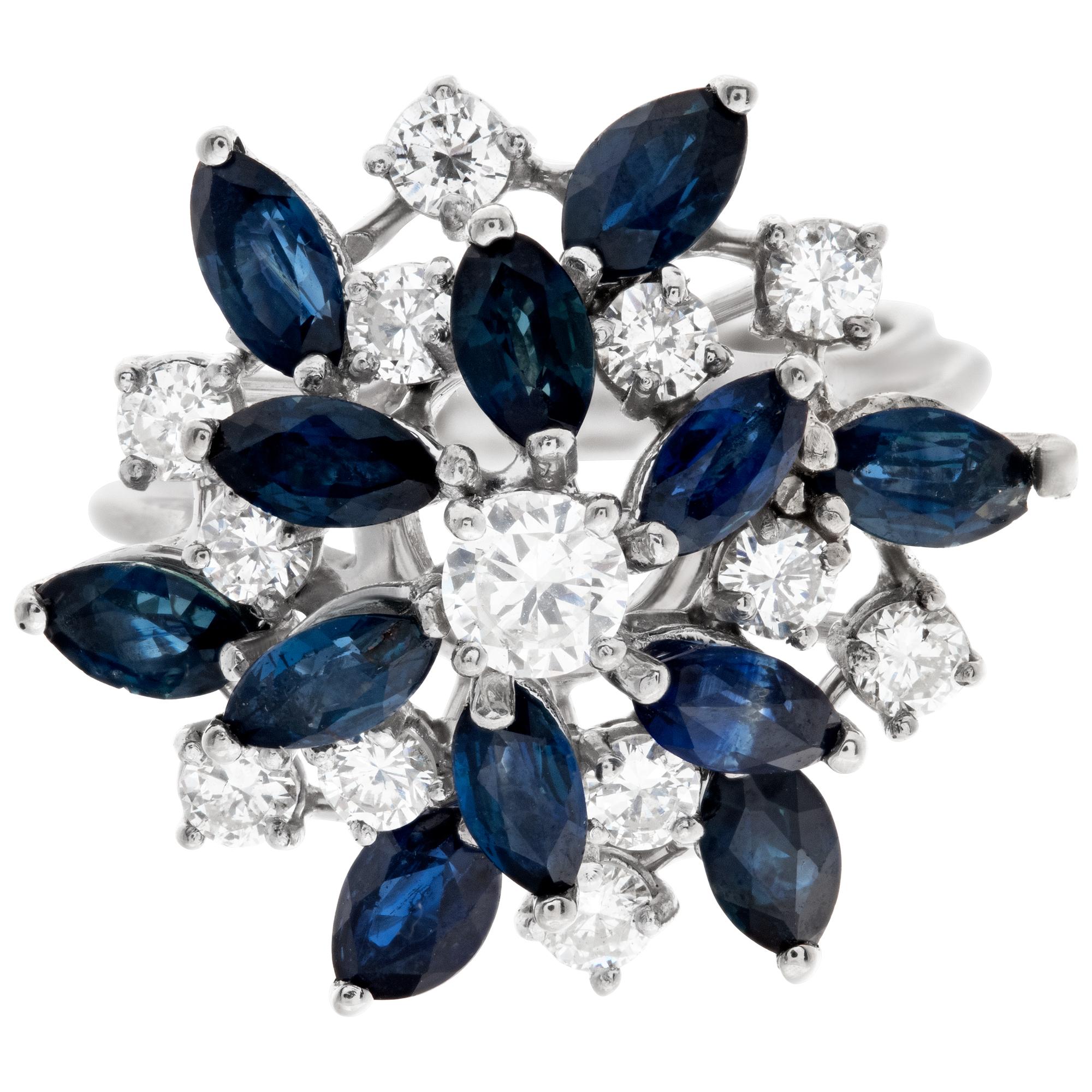 Flower style diamond and sapphire ring in 14k white gold, with approximately 1.50 carats in G-H color, VS-SI clarity diamonds and over 2 carats in blue sapphires. size 6

This Diamond/Sapphires ring is currently size 6 and some items can be sized up