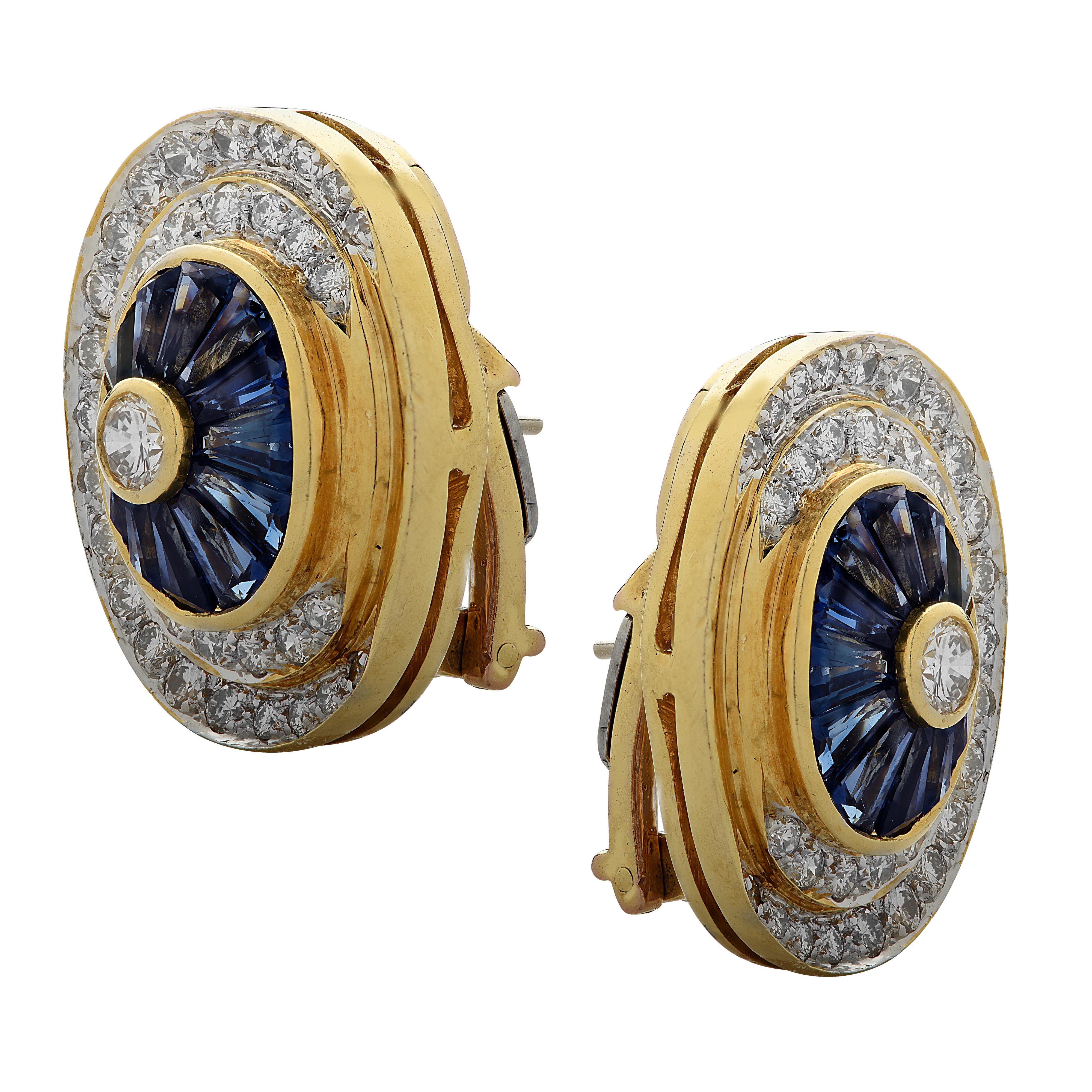 Stunning stud earrings crafted in yellow and white gold, featuring 76 round brilliant cut diamonds weighing approximately 2 carats total, G color, VS-SI clarity and 24 baguette cut sapphires weighing approximately 1.25 carats total. The center