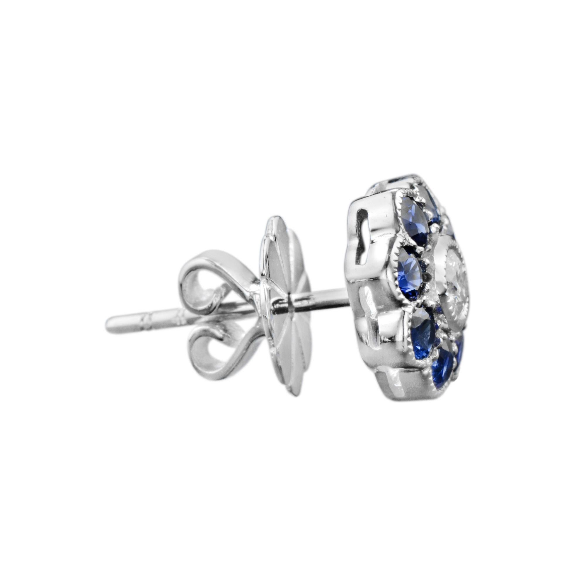 A vintage inspired pair of earrings featuring round shape blue sapphires set in a flower. Each flower is set with a round brilliant G color, VS clarity  diamond center, finished with millgrain edge. A lovely pair for your beautiful day.  

Earrings
