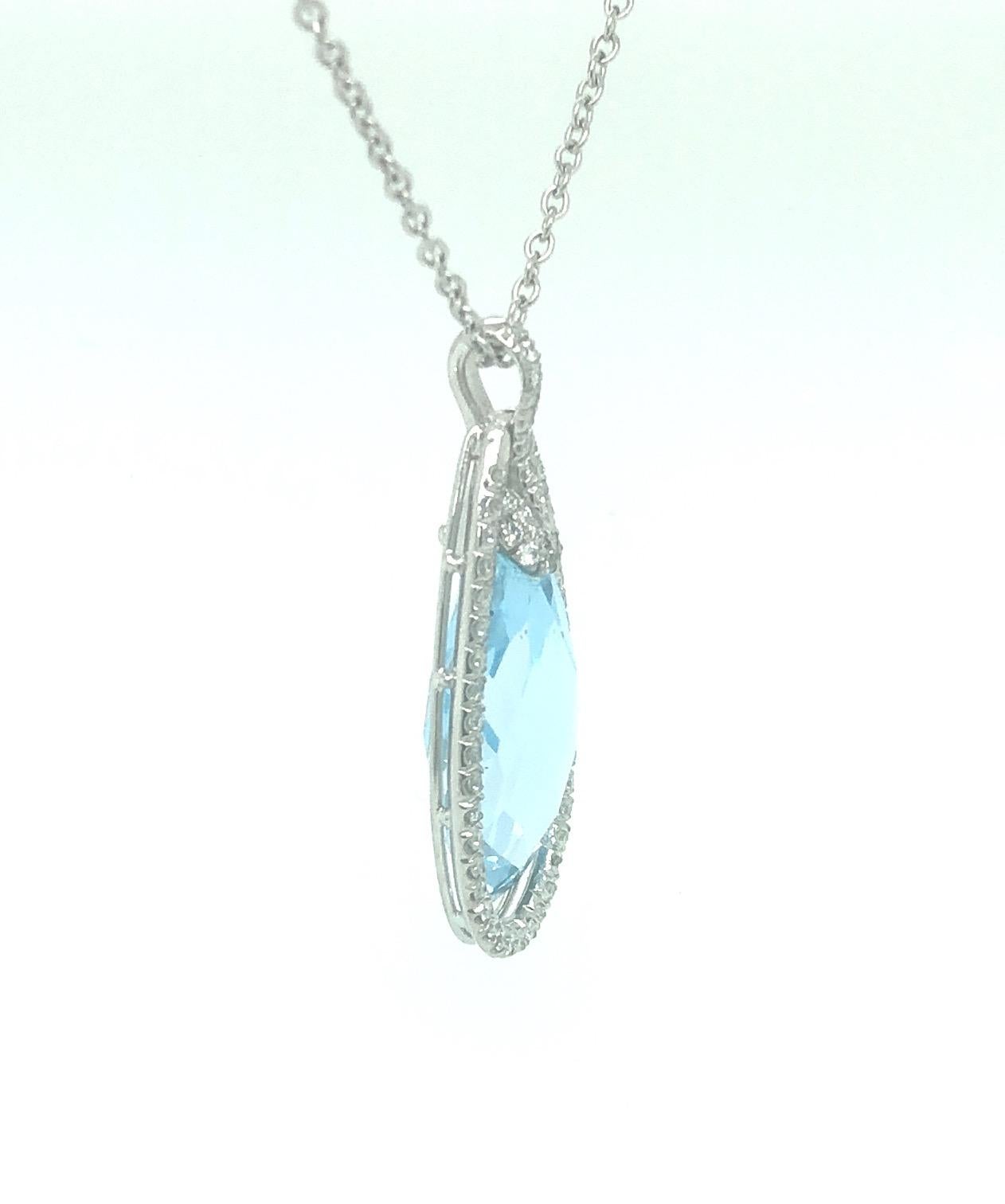 Diamond and Sky Blue Pear Topaz Pendant 

Total Carat Weight of Diamonds 0.50 carat

F/G Color VS Clarity

Sky Blue Topaz Pear measures  36.0 x 17.0mm

Set in 18K White Gold

With 16.0