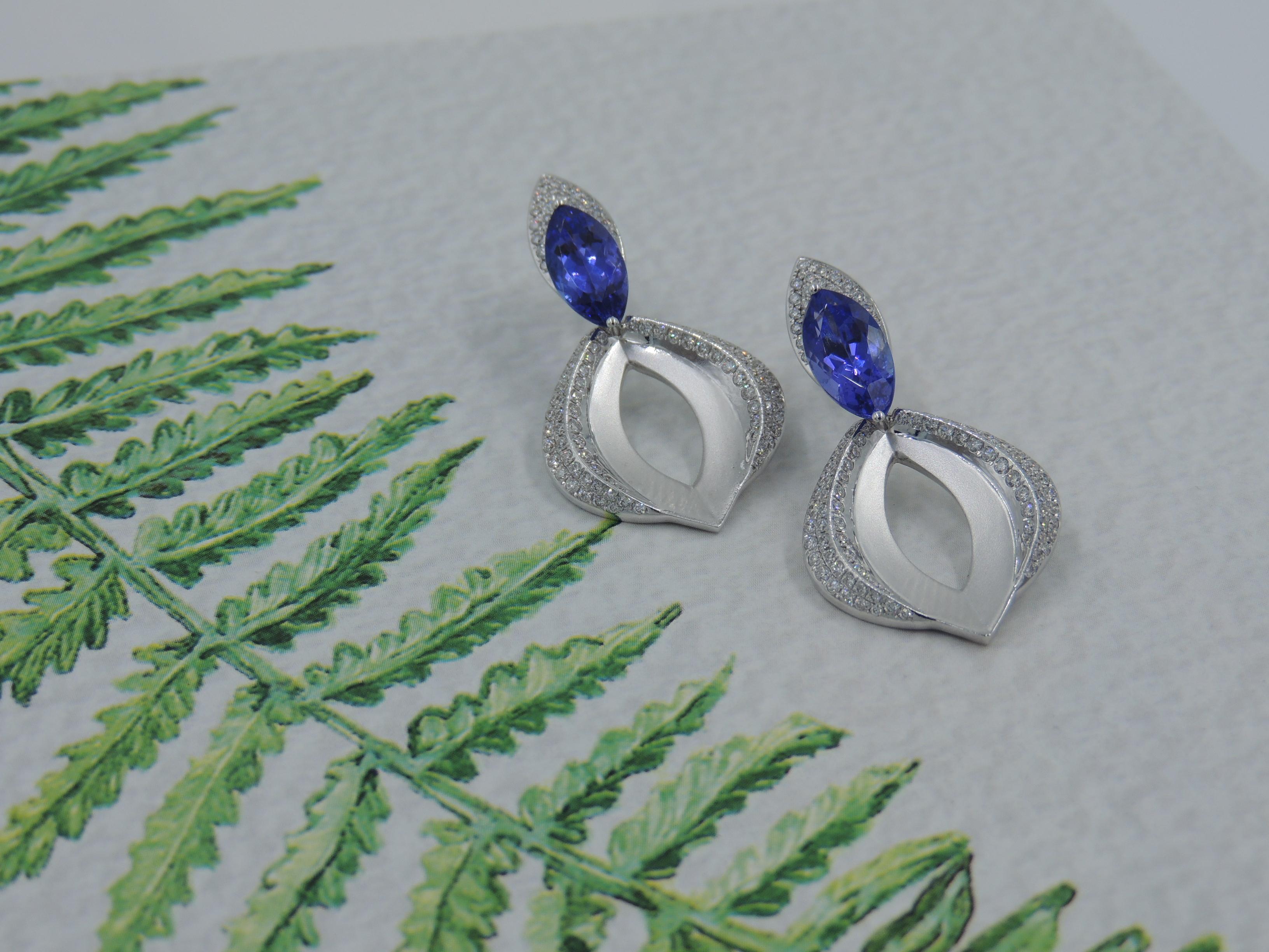 This pair of versatile of diamond and tanzanite earrings are the example of innovative engineering by our brand. This bold yet elegant pair of earrings can be worn in 3 different ways making it an exceptional accessory for any occasion. 

The user