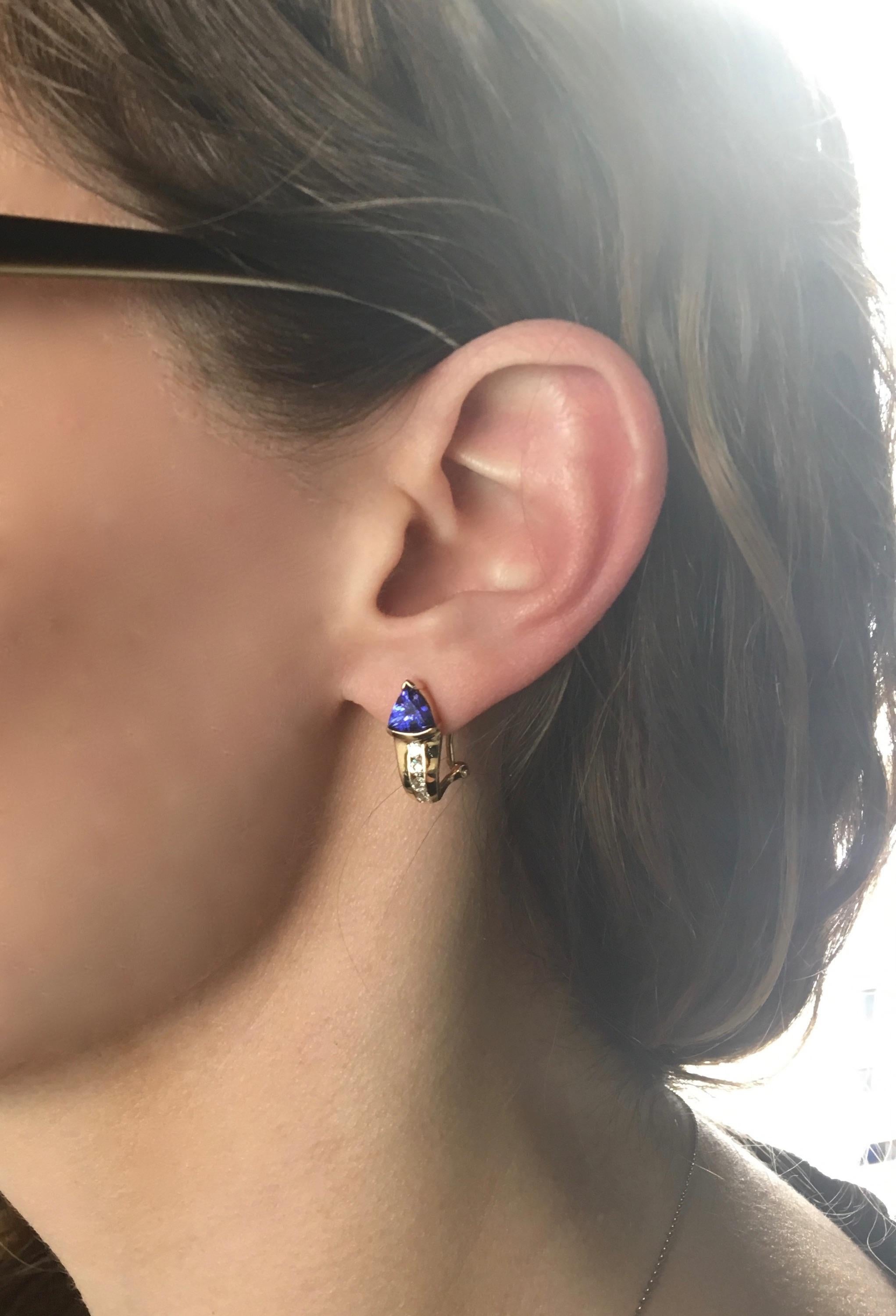 Stunning Le Vian Tanzanite and Diamond earrings set in 14K yellow gold.

Gemstone: Tanzanite & Diamond
Gemstone Carat Weight: Approximately 5.95 x 5.57mm
Diamond Carat Weight: Approximately .36CTW
Diamond Cut: 8 Round Brilliant
Color: Average
