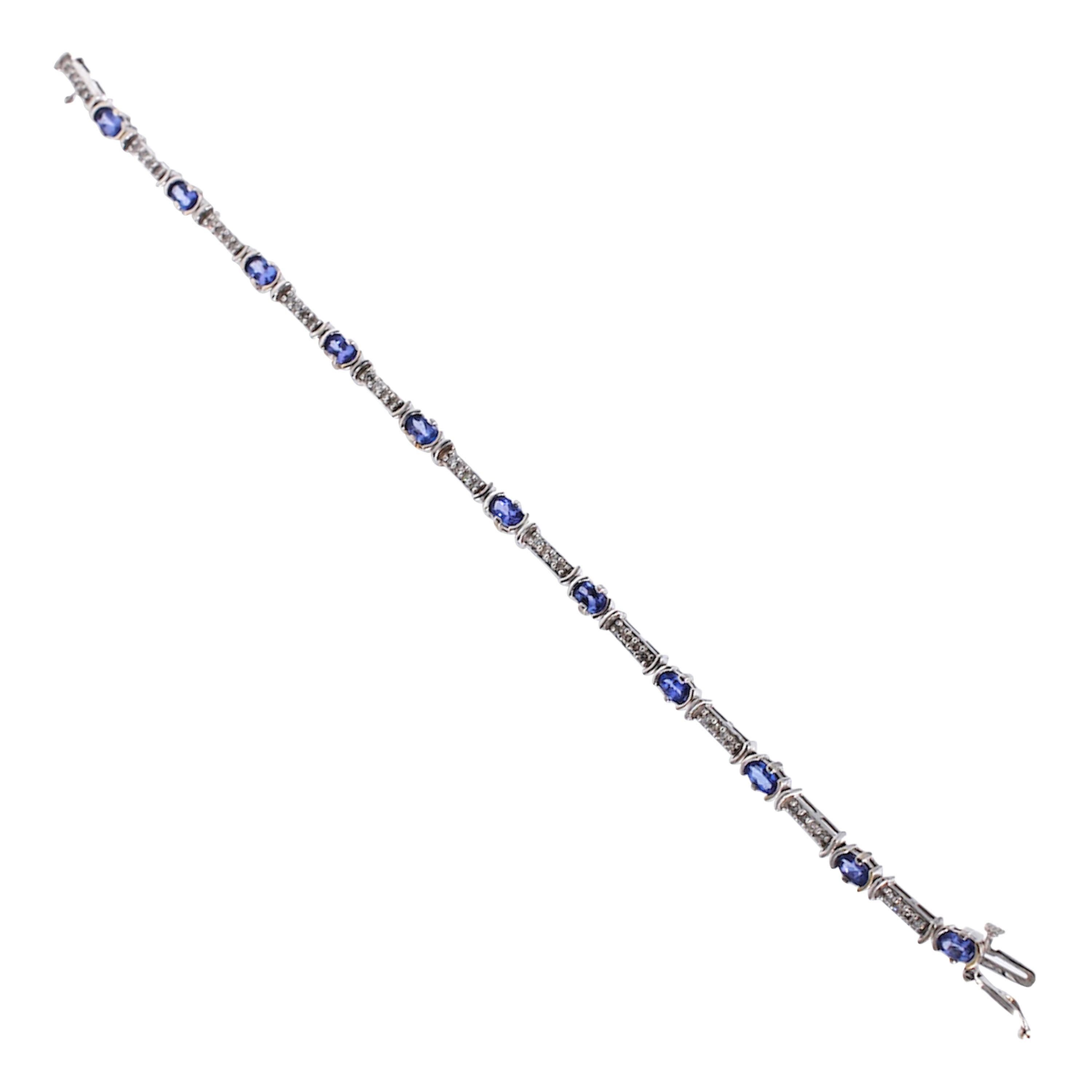 Diamond and Tanzanite, Tennis 3.33 TCW Bracelet, Tube Set 14 Karat Gold 
7 inches in length tennis bracelet with alternating Tanzanite and diamonds. 
(11) oval shaped Tanzanite measuring 3 x 5 mm each with a total weight of approximately 3.00 carats
