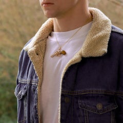 Colgante Revólver engastado con diamantes y ojo de tigre en oro rosa de 18k