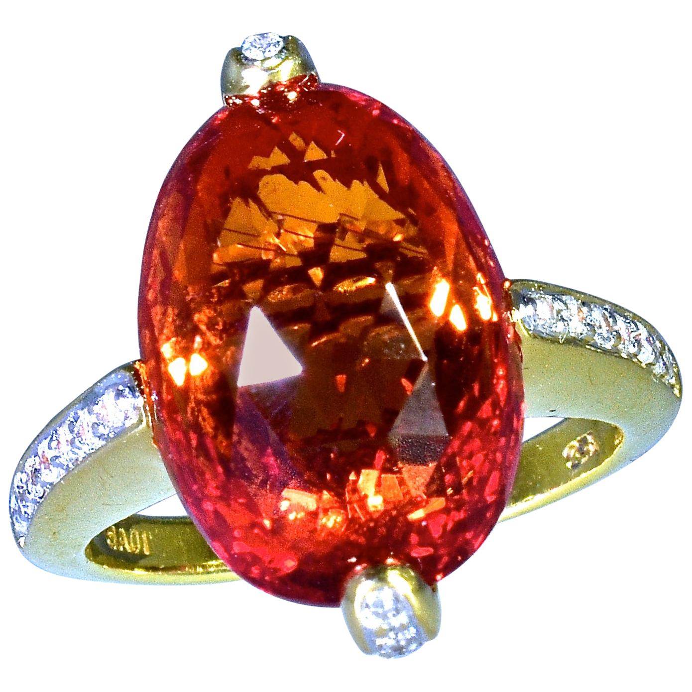 Diamond  and 18K yellow gold ring centering a Topaz, fancy rose-cut (completely faceted on the top and sides), this natural stone is a pink/orange/red color.  This stone measures 14.7 mm by 10.5 mm by 9.2 mm.  It is estimated to weigh conservatively