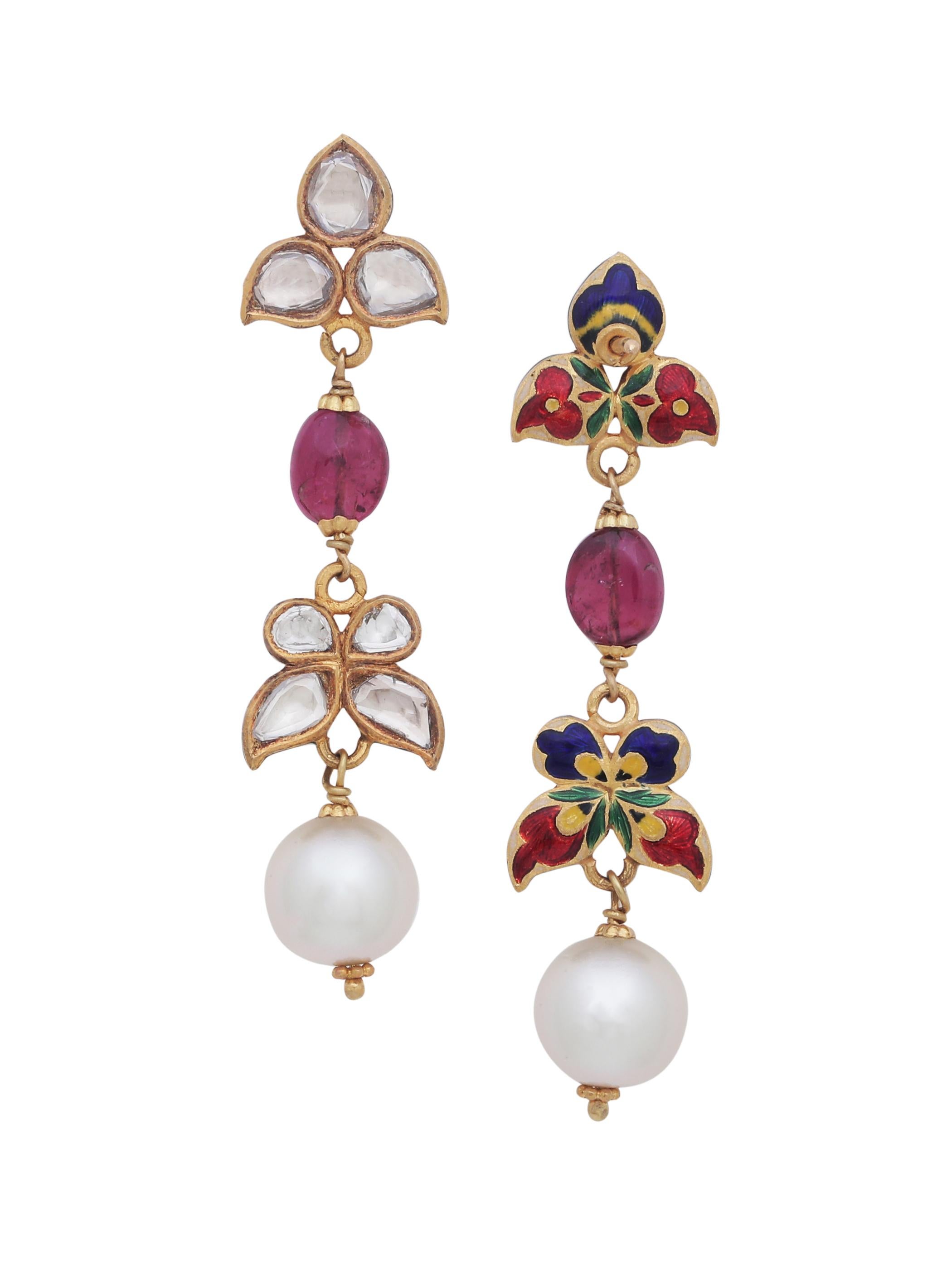 A pair of elegant earrings with flat uncut diamonds and a pair of fine tourmaline bead. The colour of tourmaline is referred to as Rubellite which is a super hot selling stone at the moment!
The piece is handcrafted in 18K Gold and has nice enamel