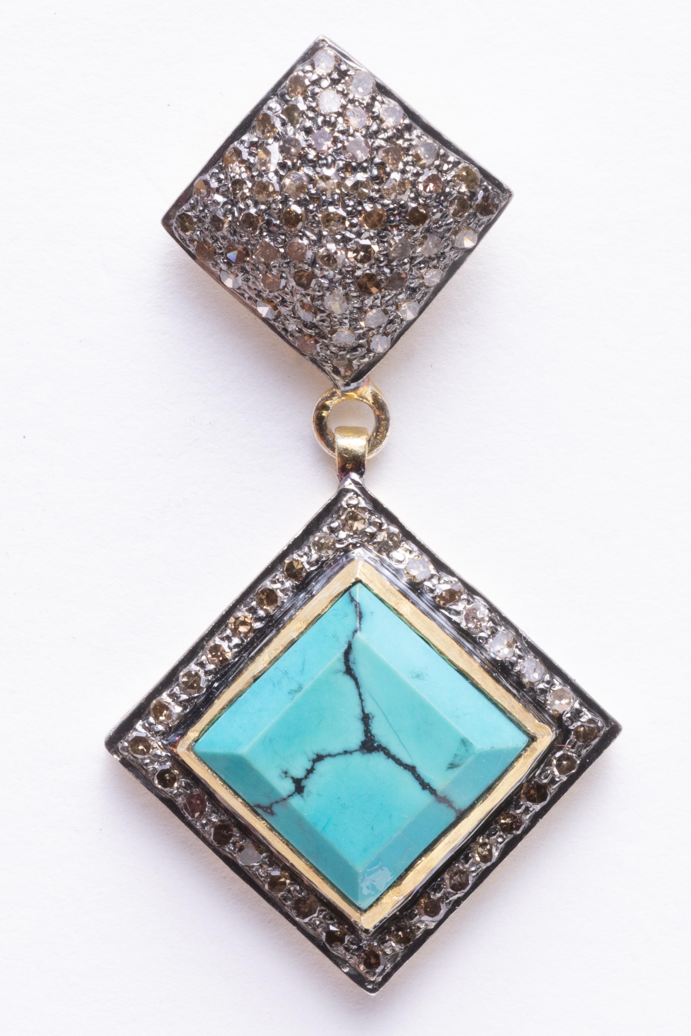 Pave` set diamonds adorn the post of these drop earrings and also border the beveled square turquoise stones set on the diagonal.  The turquoise is American with a nice matrix to it.  Carat weight of diamonds total 1.75 carats and the turquoise