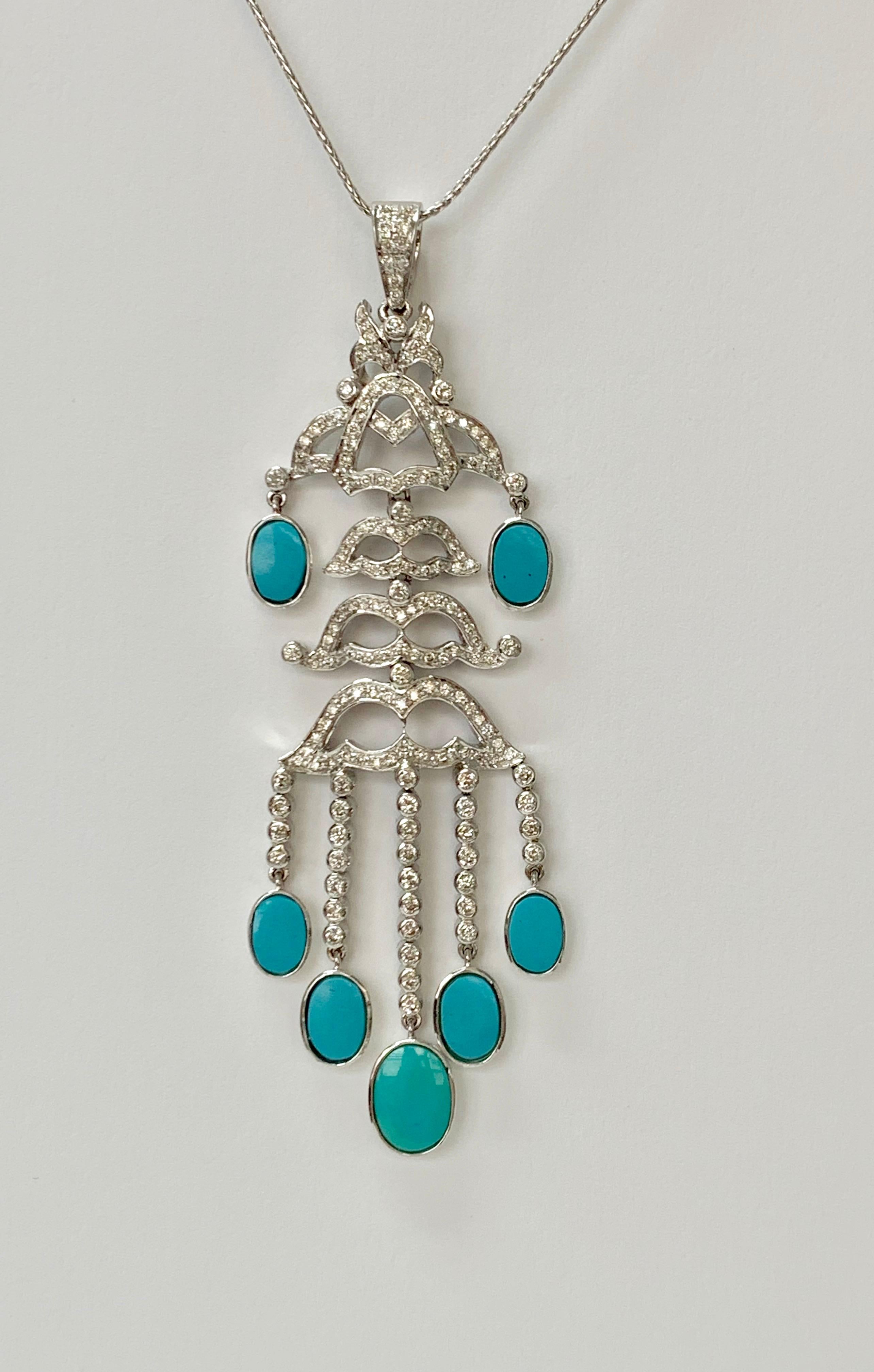 Diamond and Turquoise pendant necklace handcrafted in 18k white gold.
The details are as follows : 
Diamond weight : 1.64 carat ( GH color and VS clarity ) 
Turquoise weight : 5 carat 
Metal : 18k white gold 
Measurements : 3 1/2 inches long 
