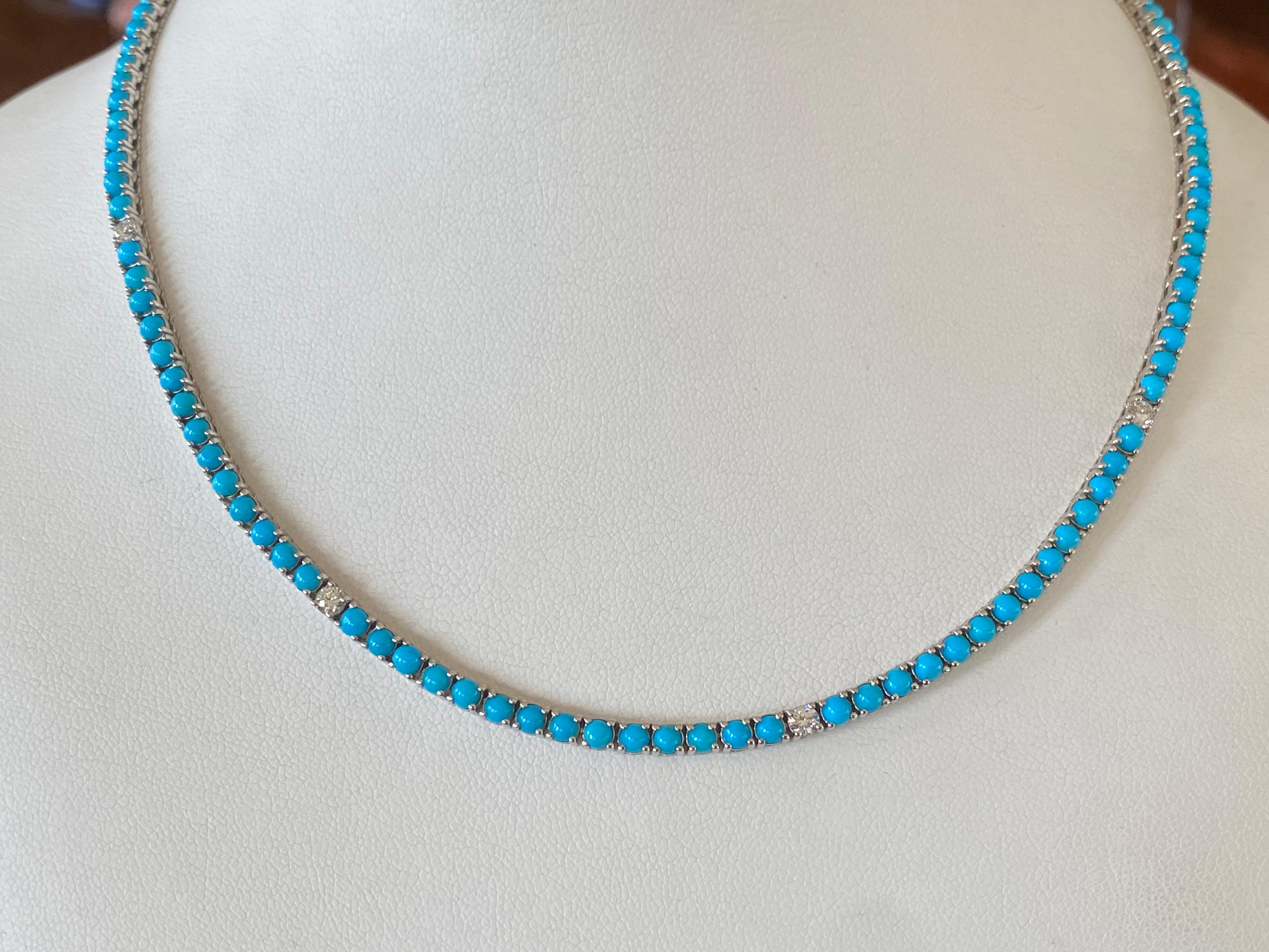This exquisite tennis necklace handcrafted in 14kt white gold features 122 natural fine turquoise round-shaped cabochon beads mined in Arizona interspersed with 9 natural round diamonds totaling 0.90 carats, G-H color, SI clarity. The necklace
