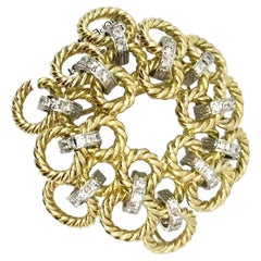 Spilla/pendente circolare con diamanti e corda ritorta in oro 14K