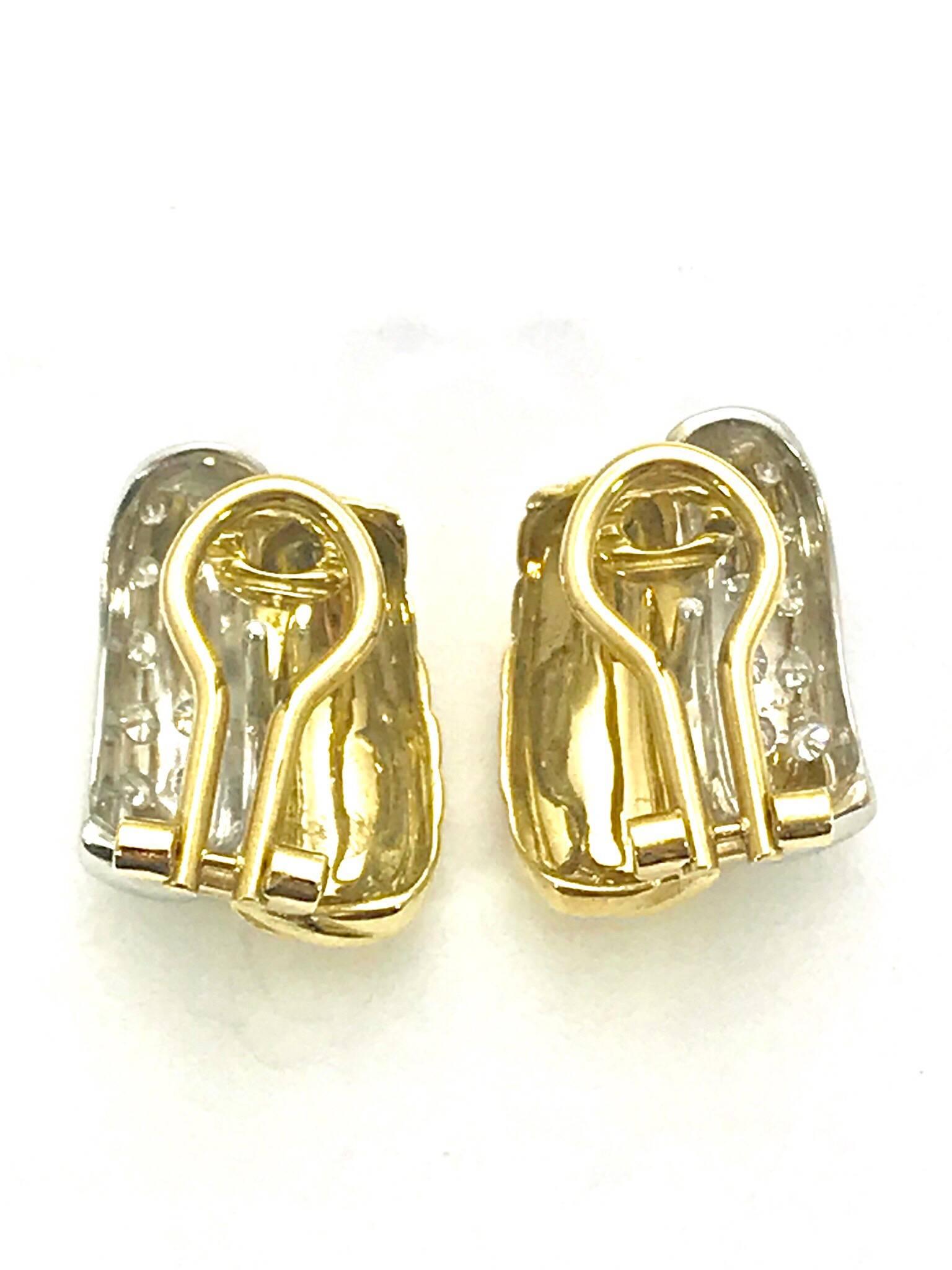 Diamond and 18 karat white and yellow gold clip and post earrings.  There are 24 round brilliant diamonds that are G color, VS clarity, with a total weight of .50 carats set in white gold.  

Hallmark:  750