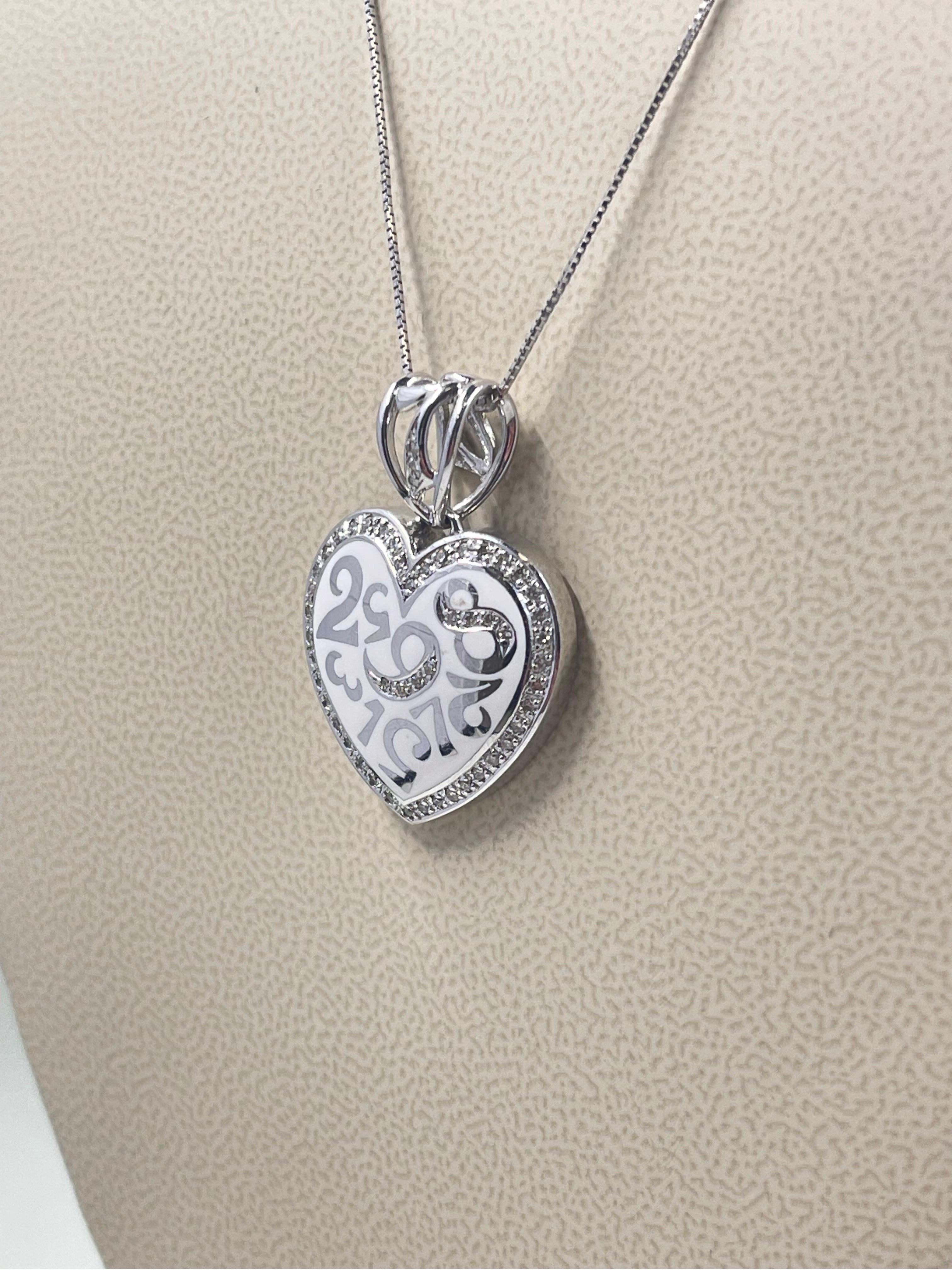 Diamond And White Enamel Heart Necklace In 18k White Gold.

0.38 carats in diamonds,

Length is 18”.