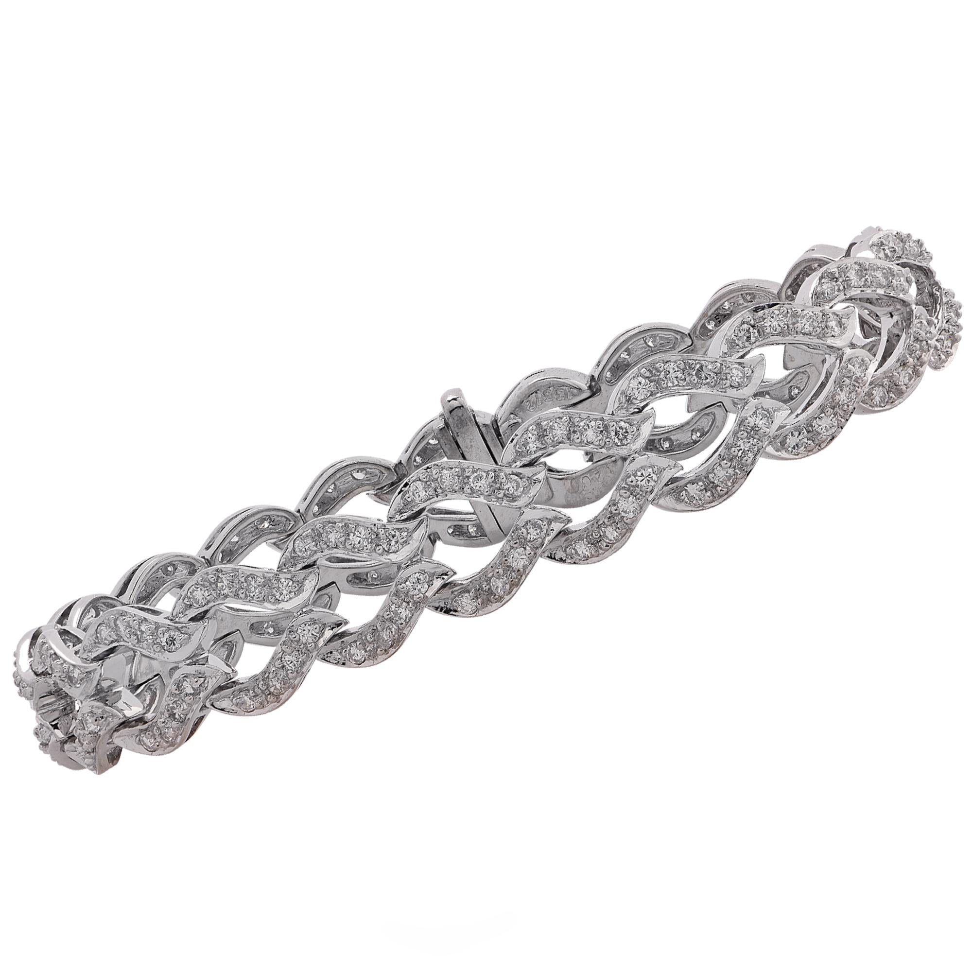Gorgeous diamond bracelet crafted in 18 karat white gold, featuring approximately 168 round brilliant cut diamonds weighing approximately 3.35 carats, G color, VS clarity. The stunning diamond encrusted links wrap around your wrist and sit
