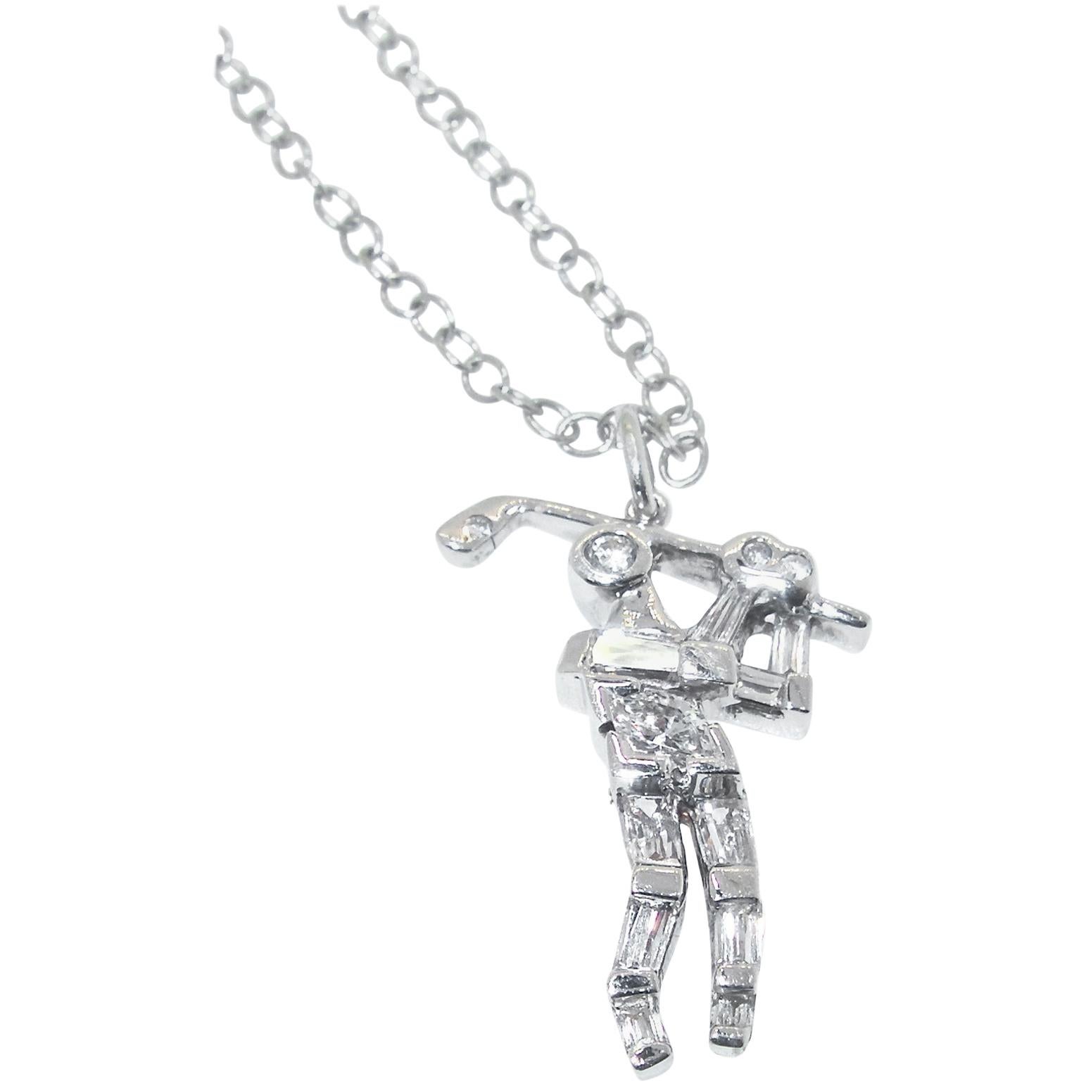 Diamond  pendant of a golfer in 18K white gold with fancy cut fine white diamonds suspended on a white gold chain of 17 inches long.  The golfer, including the bale, is just shy of one inch long.