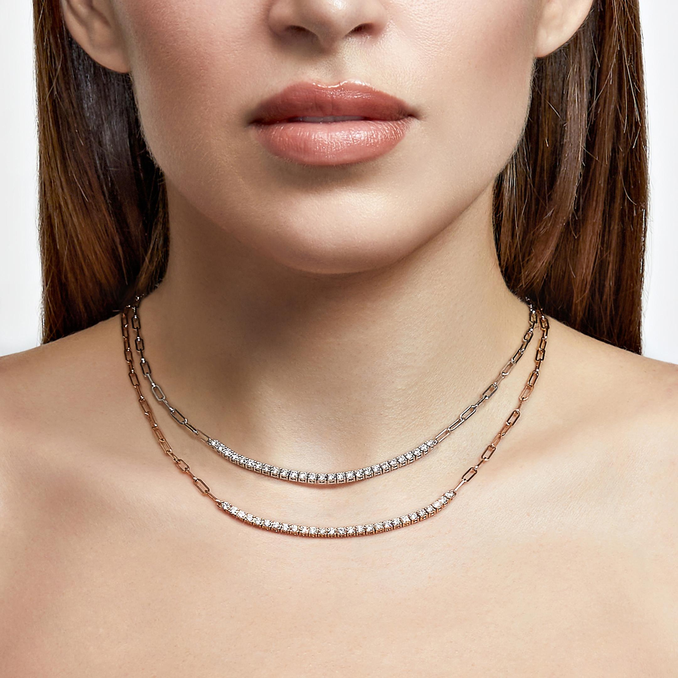 The diamond tennis necklace gets a cool girl makeover in the Diamond and Gold Paperclip Chain Necklace. Get the best of every world with an 18-karat rose or white gold chain accented with a sparkling row of diamonds weighing 1.31 carats. The mix of