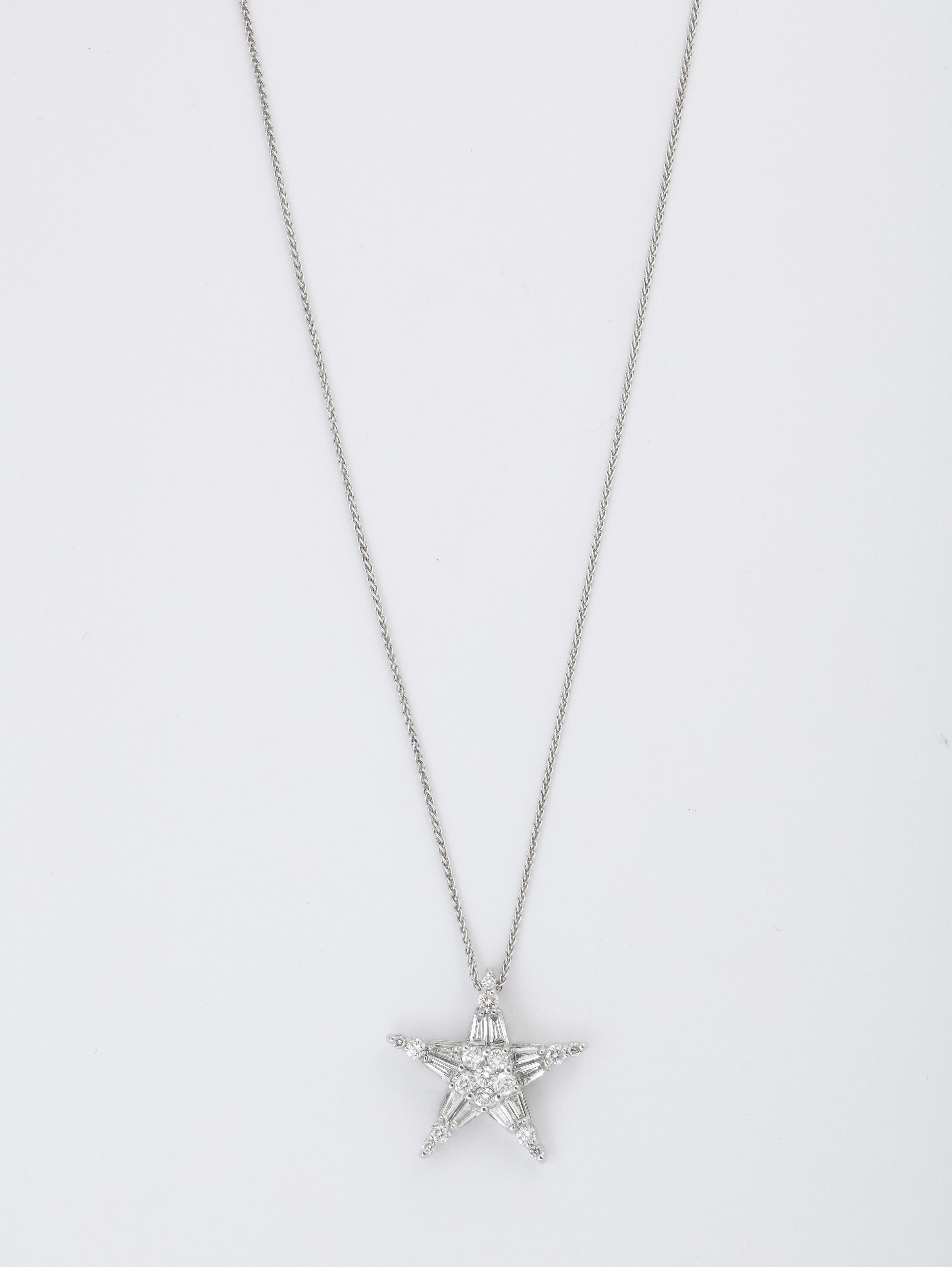 A diamond and white gold 5 point star necklace comprised of baguettes and round diamonds. A day wearable timeless piece. 