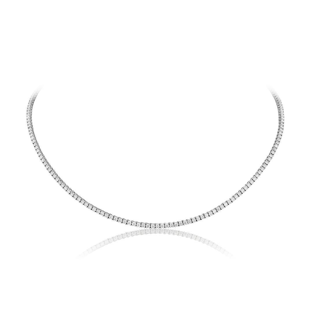 Elevate your attire with the unparalleled grace and sophistication of the White Gold Diamond Tennis Necklace.

Crafted from the finest white gold, this exquisite necklace showcases a dazzling array of brilliant-cut diamonds meticulously set in a