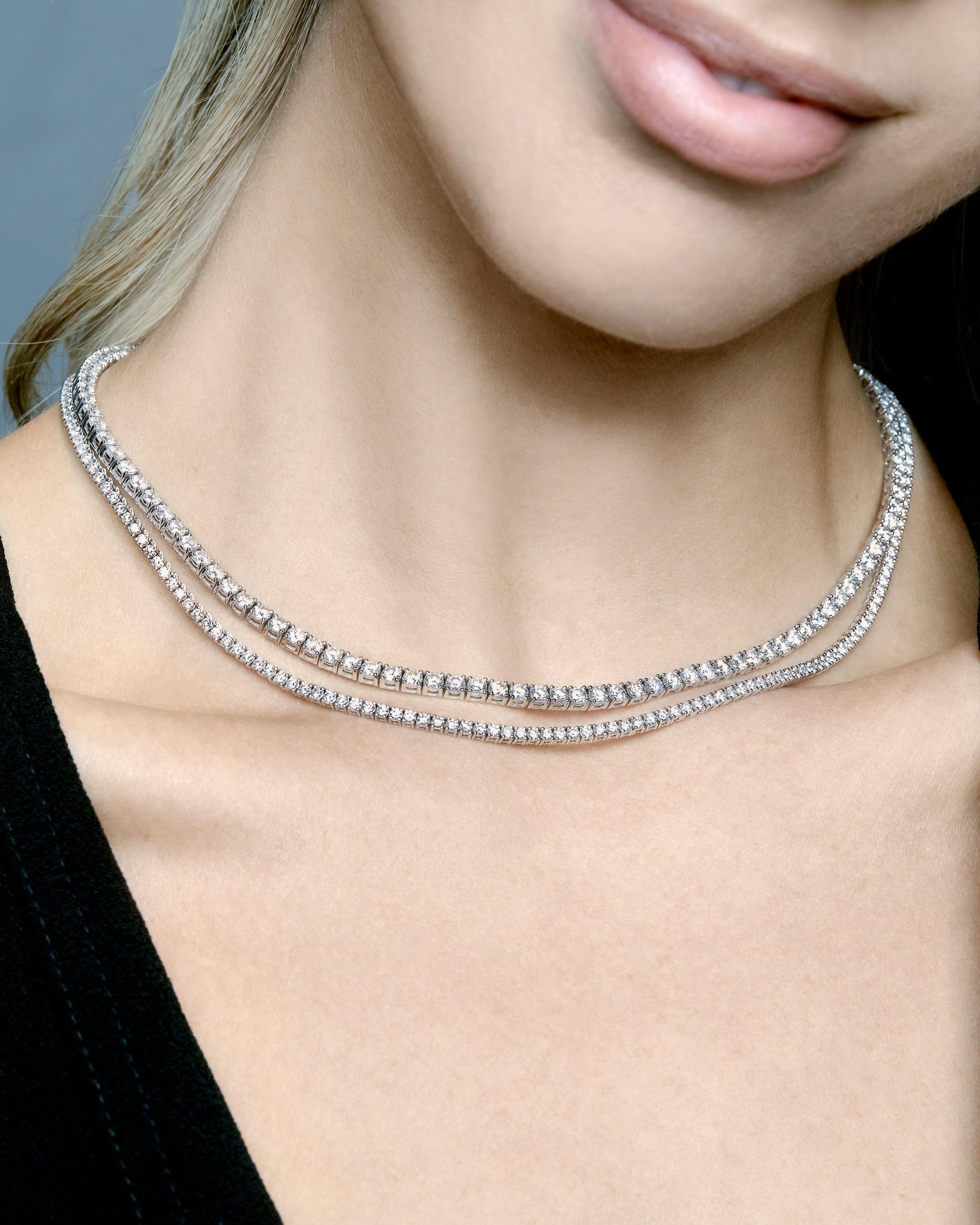 Elevate your attire with the unparalleled grace and sophistication of the White Gold Diamond Tennis Necklace.

Crafted from the finest white gold, this exquisite necklace showcases a dazzling array of brilliant-cut diamonds meticulously set in a