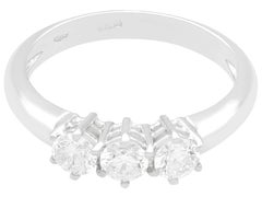 Brilliant Round Cut Diamond and White Gold Trilogy Ring