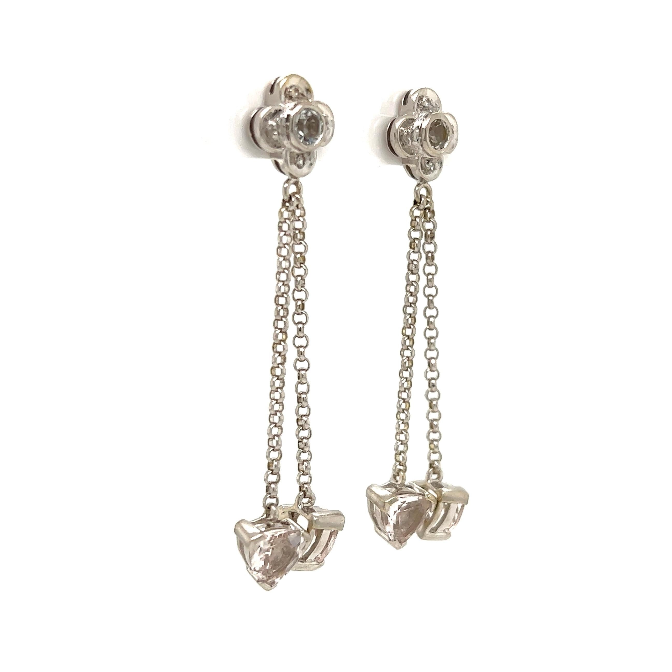 Beautiful and Stylish Diamond and White Topaz Gold Dangle Drop Earrings. Hand crafted in 14K White Gold. Measuring approx. 1.80” Long. Chic and Classic…A complement to your wardrobe! A striking Fashion Statement! 
