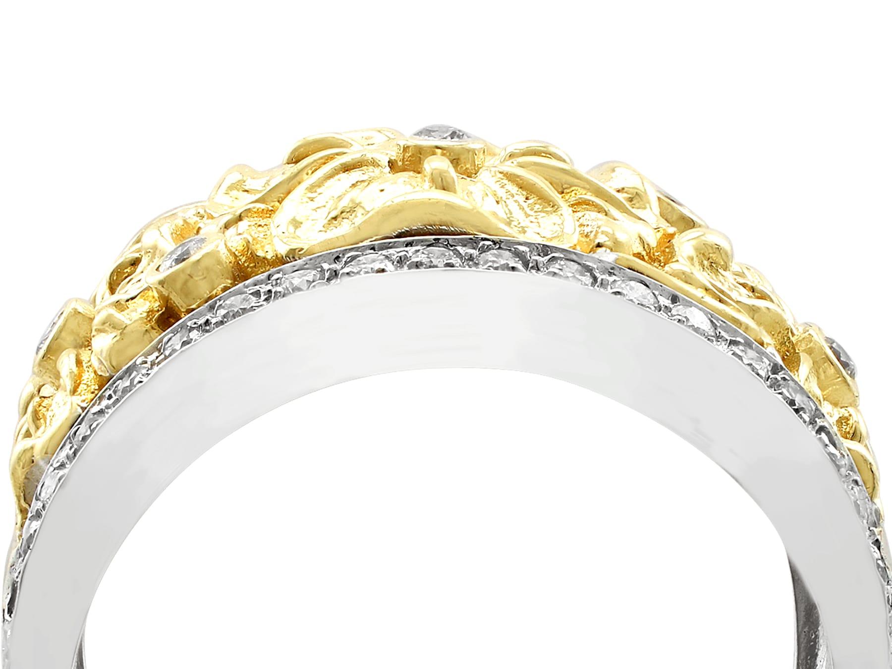 An impressive 0.50 carat diamond and 18 karat yellow and white gold floral dress ring; part of our diverse diamond jewelry and estate jewelry collections.

This fine and impressive vintage gold ring has been crafted in 18k yellow and white
