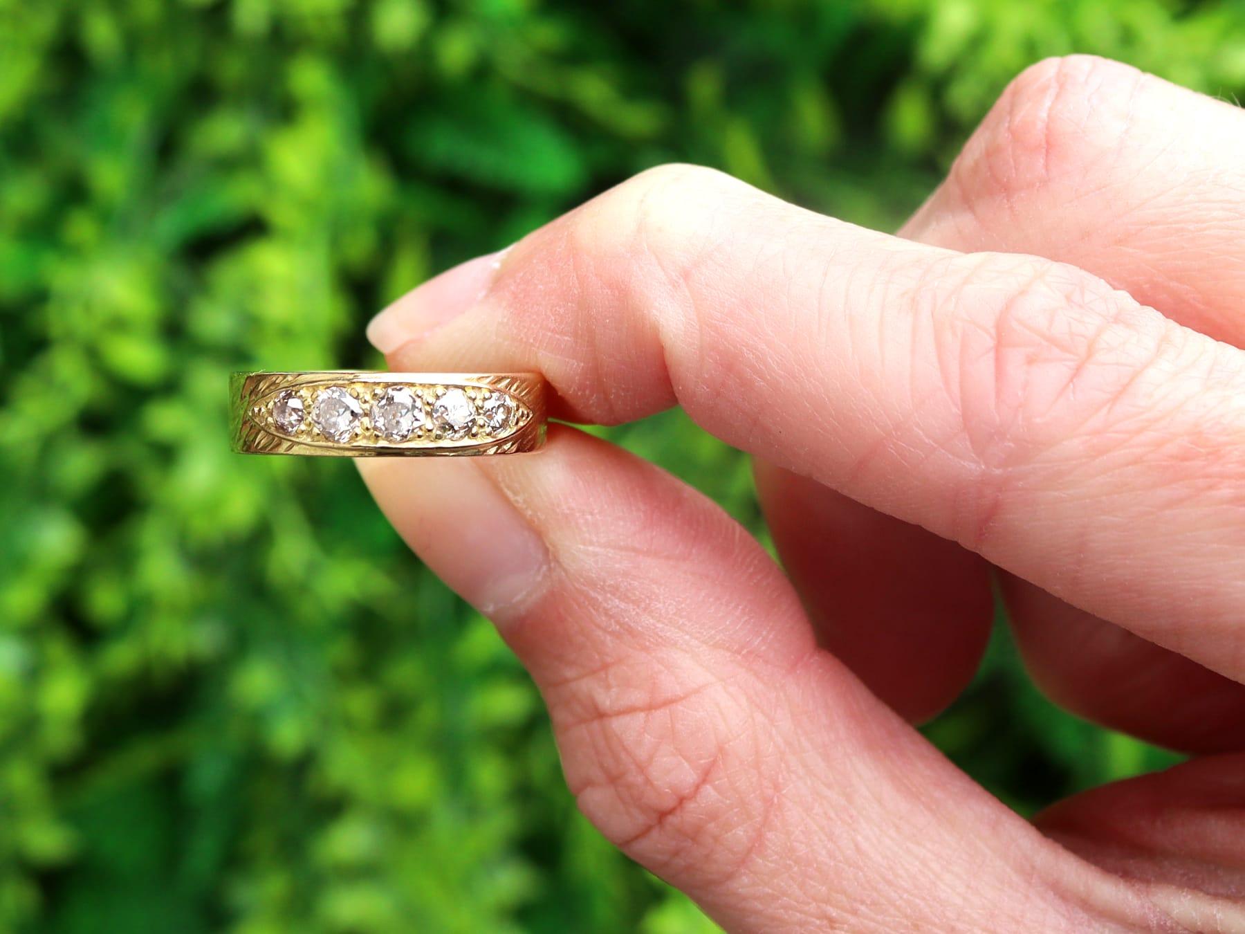 A fine and impressive vintage 18 karat yellow gold dress ring set with 0.40 ct of antique diamonds; part of our diverse vintage jewelry and estate jewelry collections

This fine and impressive five stone diamond band has been crafted in 18k yellow