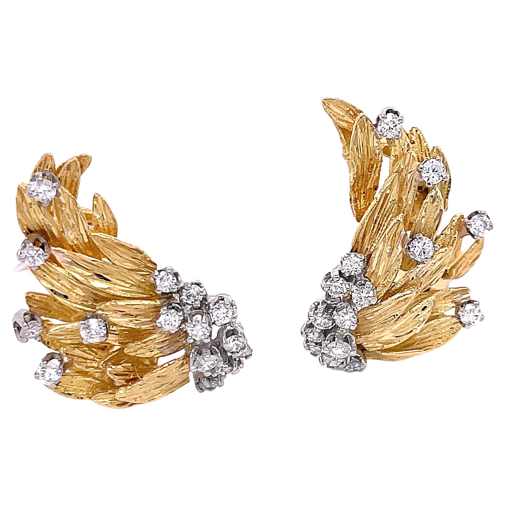 Beautiful French-designed 18K yellow gold retro ear climber diamond angel wing earrings. The earrings have a total of 32 round brilliant diamonds. There is a lever back that helps keep the earring correctly placed on your ear.