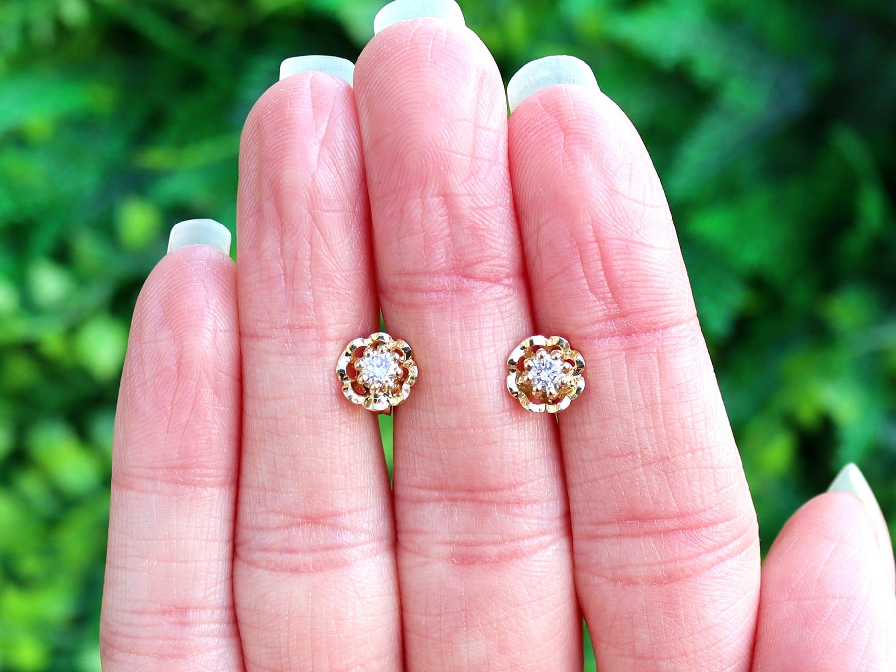 An impressive pair of vintage 1960s 0.28 carat diamond and 18 karat yellow gold stud earrings; part of our diverse diamond jewelry and estate jewelry collections.

These fine and impressive gold stud earrings have been crafted in 18k yellow