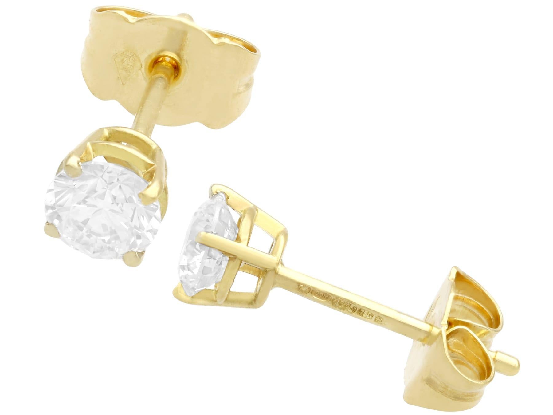 A pair of vintage 0.67 carat transitional modern brilliant round cut diamond stud earrings with contemporary 18 karat yellow gold settings; part of our vintage jewelry collections.

These impressive vintage diamonds are displayed in contemporary