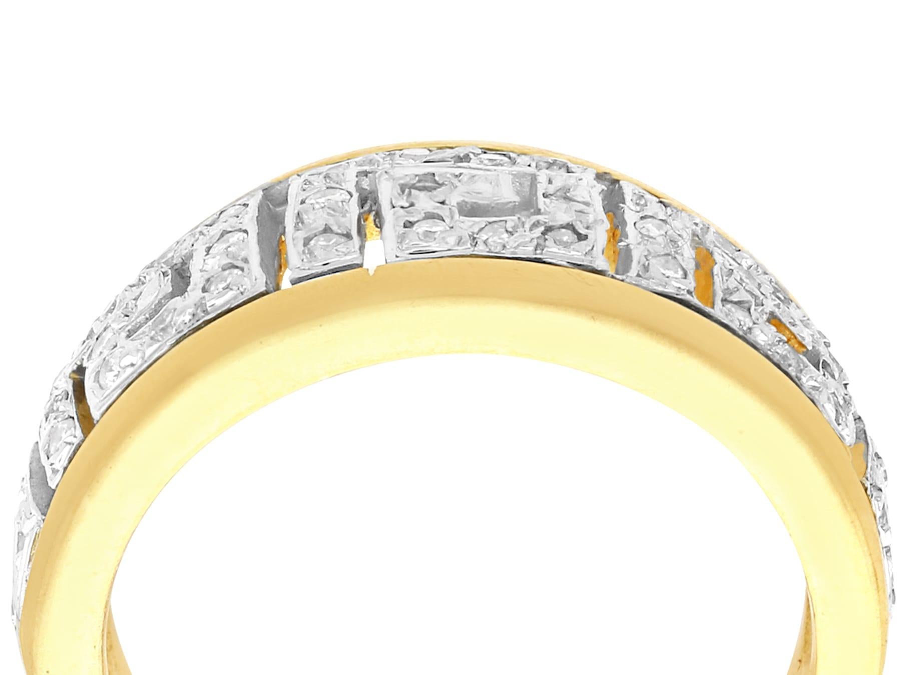 A fine 0.52 carat diamond and 18 karat yellow gold, 18 karat white gold set dress ring; part of our diverse contemporary jewelry collection.

This fine diamond band ring ring has been crafted in 18k yellow gold with an 18k white gold setting.

The