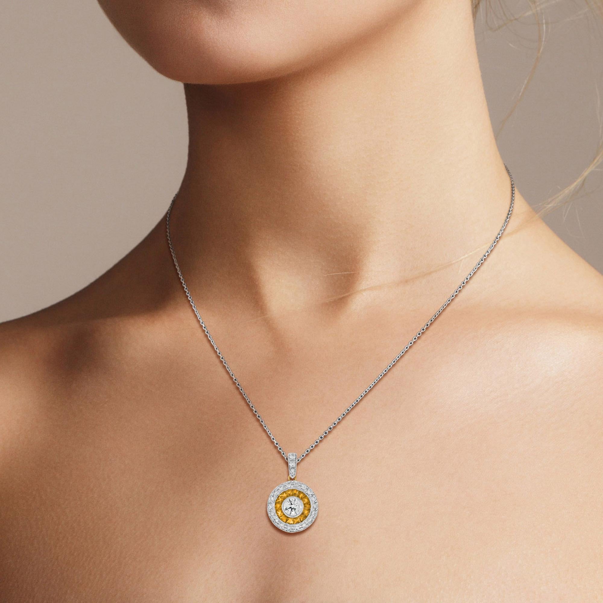 This Art-Deco pendant are completely spectacular! The vibrant color stone of yellow sapphire are specialty cut to surround the excellent round brilliant cut center diamond, which is in a thin bezel with mil-grain detail. Crafted in 18k two tone