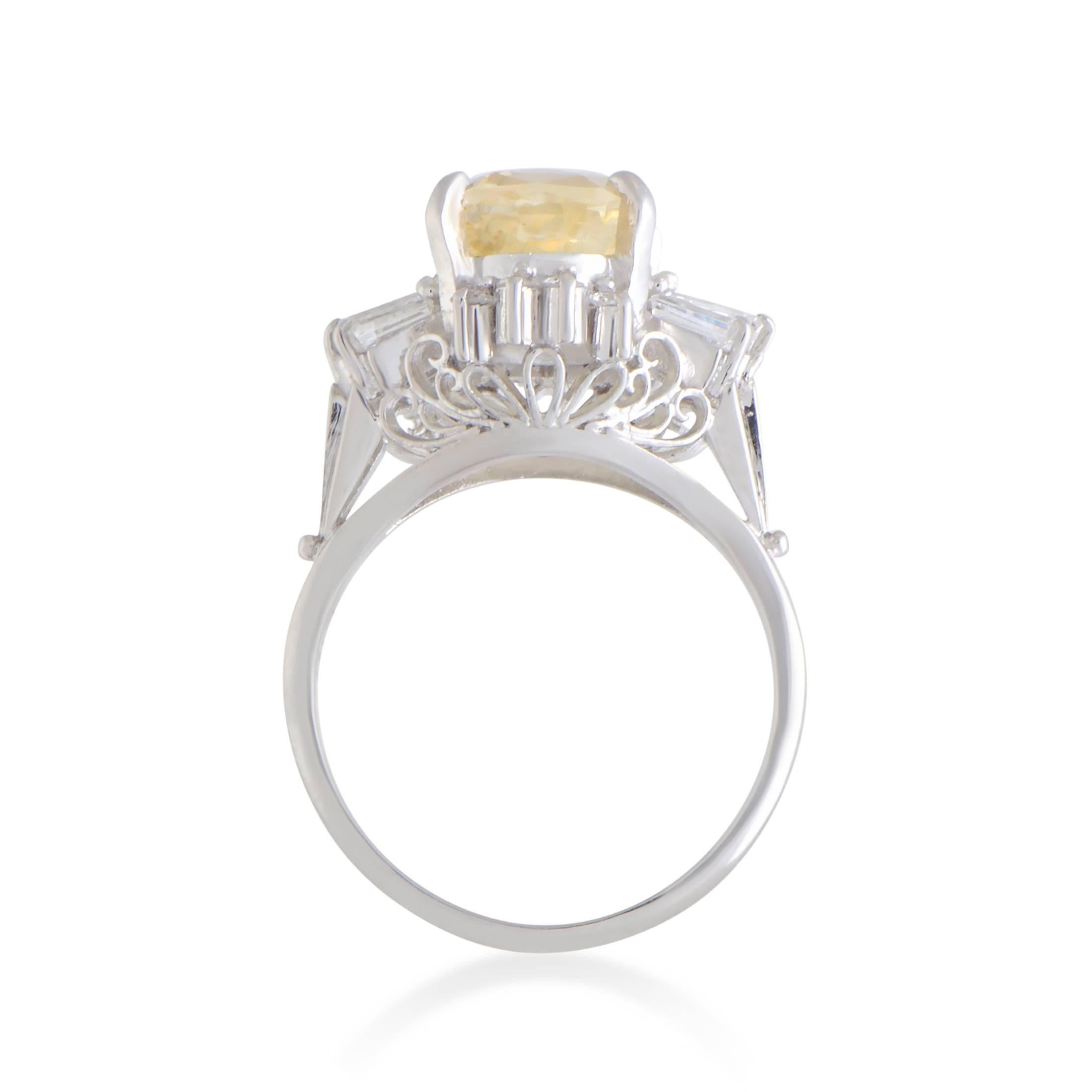 Superbly crafted from elegant platinum and beautifully set with glistening diamonds and a sublime yellow sapphire, this gorgeous ring offers a wonderfully feminine appearance. The diamond stones amount to 0.65 carats, while the sapphire weighs 3.62