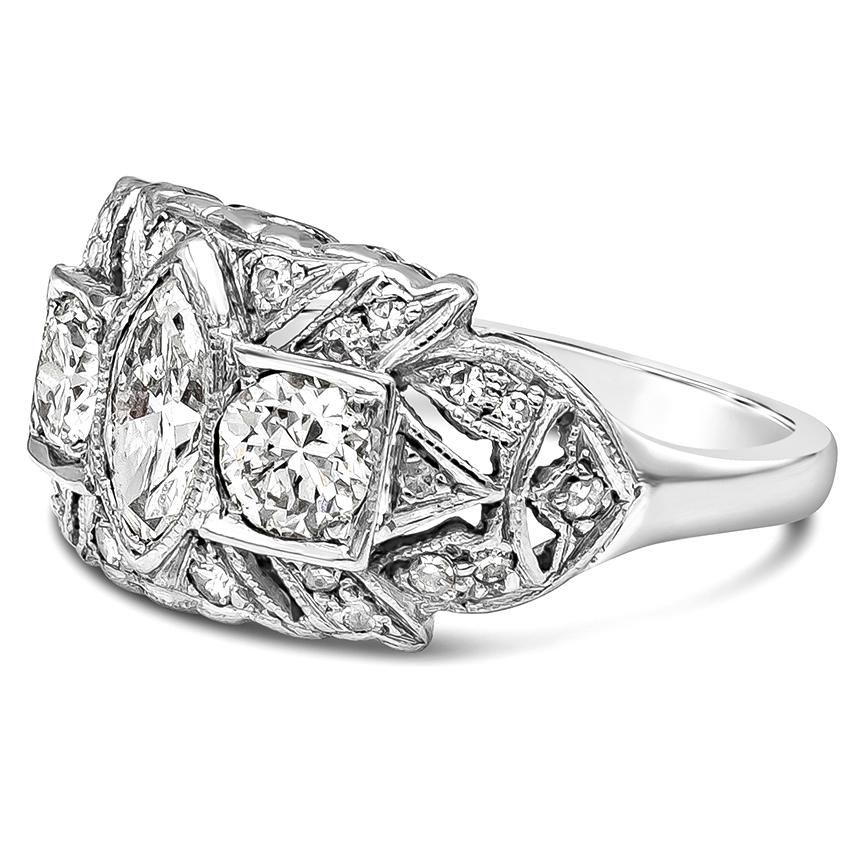 An antique engagement ring showcasing mixed-shape diamonds weighing 1.76 carats total. G-H Color and SI- SI1 in Clarity. Marquis cut weighs 0.58 carats, Round cut weighs 0.70 carats, accent diamonds 0.48 carats total. Made with 14K White Gold. Size