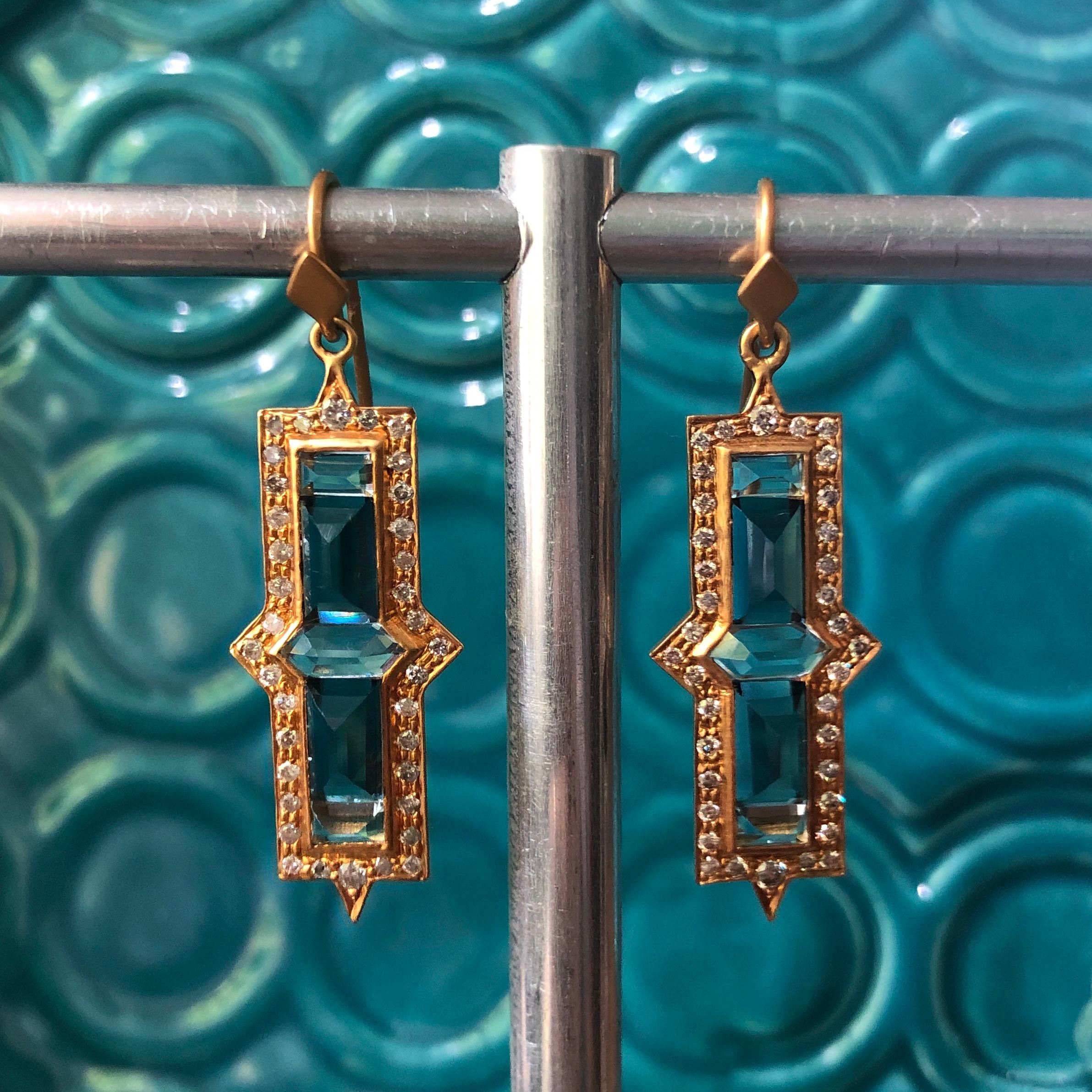 These Lauren Harper 18k Gold earrings are encrusted with diamonds that surround beautifully cut Aquamarine and London Blue Topaz set in the center.  18k Gold is finished in signature matte finish.  These earrings are lightweight for their big look,