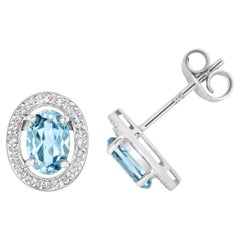 DIAMANT & AQUAMARINE OVAL HALO STUDS IN 9CT WHITE Gold