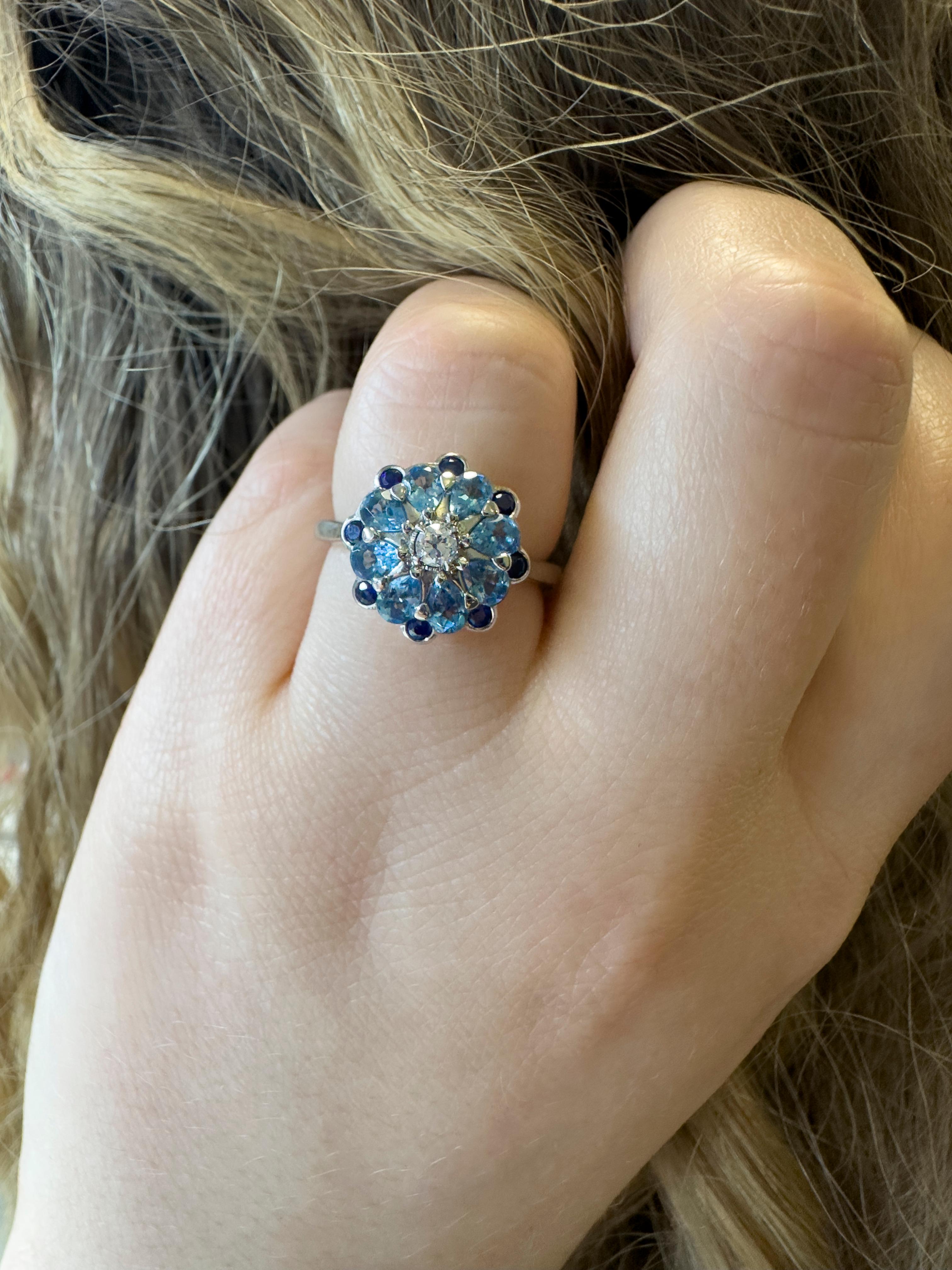 Featuring round sapphires, pear shaped aquamarines and a round old cut diamond in the centre, this pretty design has been given a modern touch by setting the gems in bright platinum. We love the combination of beautiful blues which mean this ring