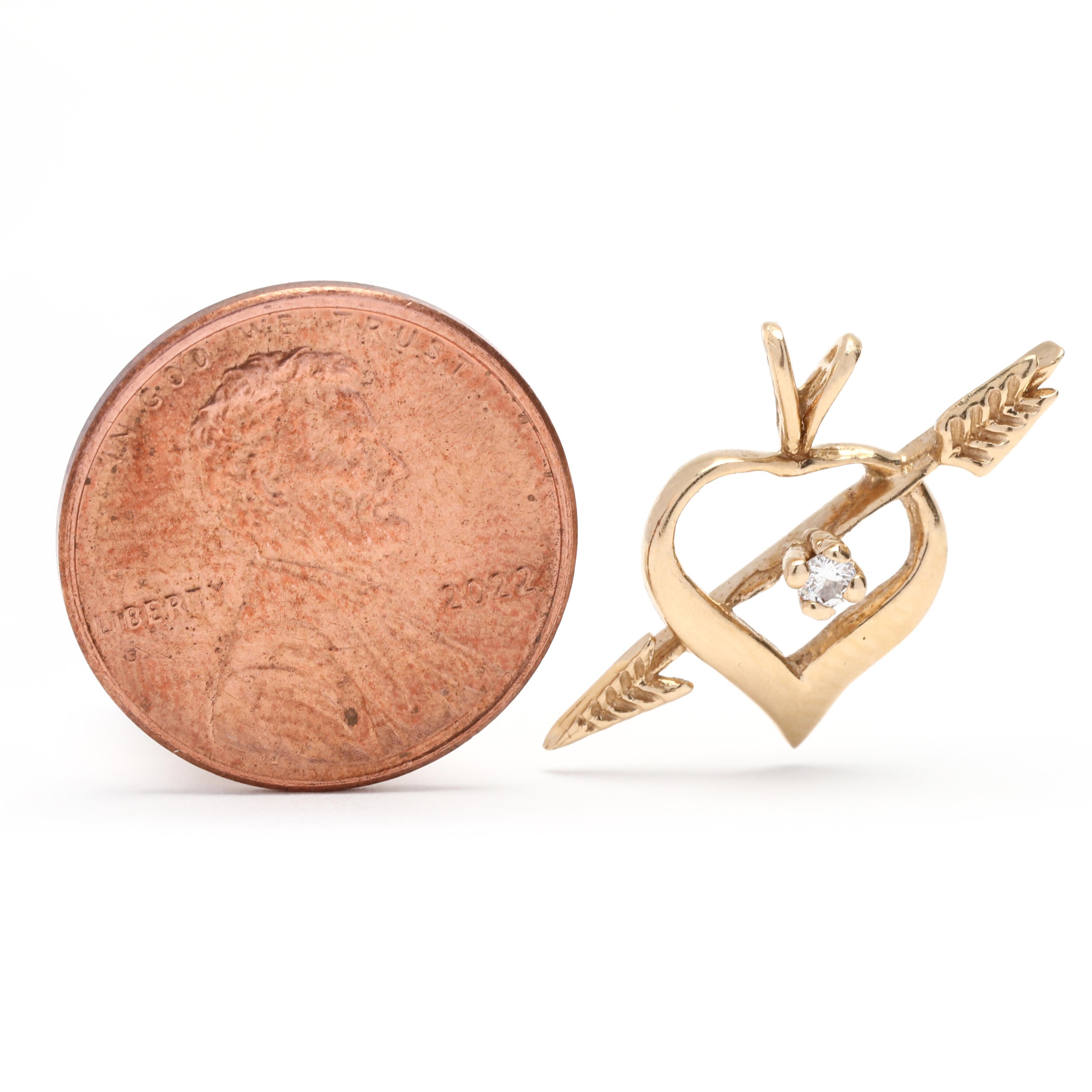 This beautiful 14K yellow gold diamond arrow through heart pendant is the perfect way to show someone you care. The 5/8 inch pendant features a sparkling open heart arrow charm with a diamond accent, sure to bring a sparkle to any outfit. Perfect as