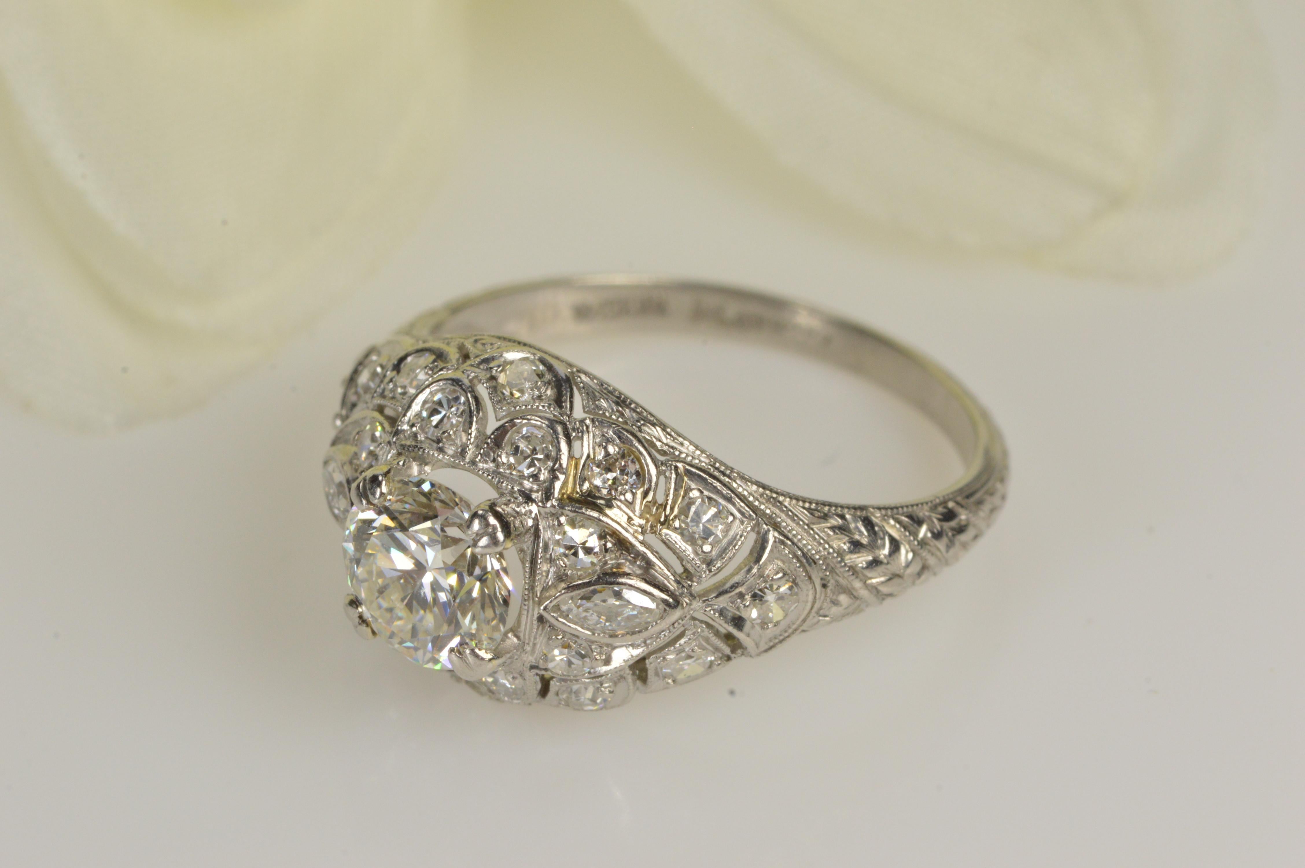 This beautufil Diamond Art Deco Engagement Ring is adourned with 1.30 carat total weight with the center stone at almost 1 carat of diamonds with few inclusions. The ring is platinum weighing 4.3 grams and is currently a size 6 but can easily be