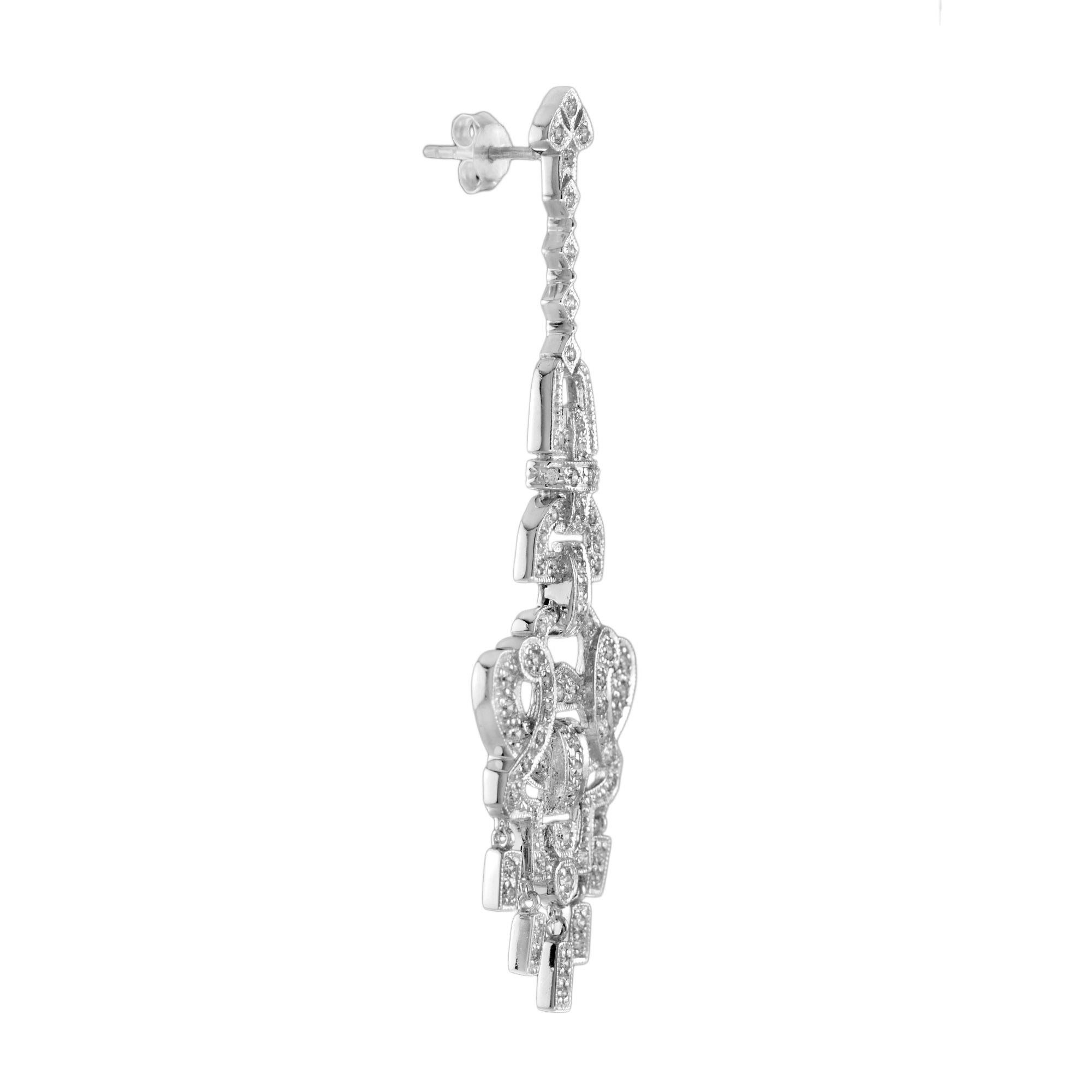 Feel the classic beauty at your next special occasion with these Art Deco inspired chandelier earrings dripping in sparkling diamonds. Exude an ultra romantic vibe when you complete the look with long, loose wave. 14K White Gold. 
Information
Style: