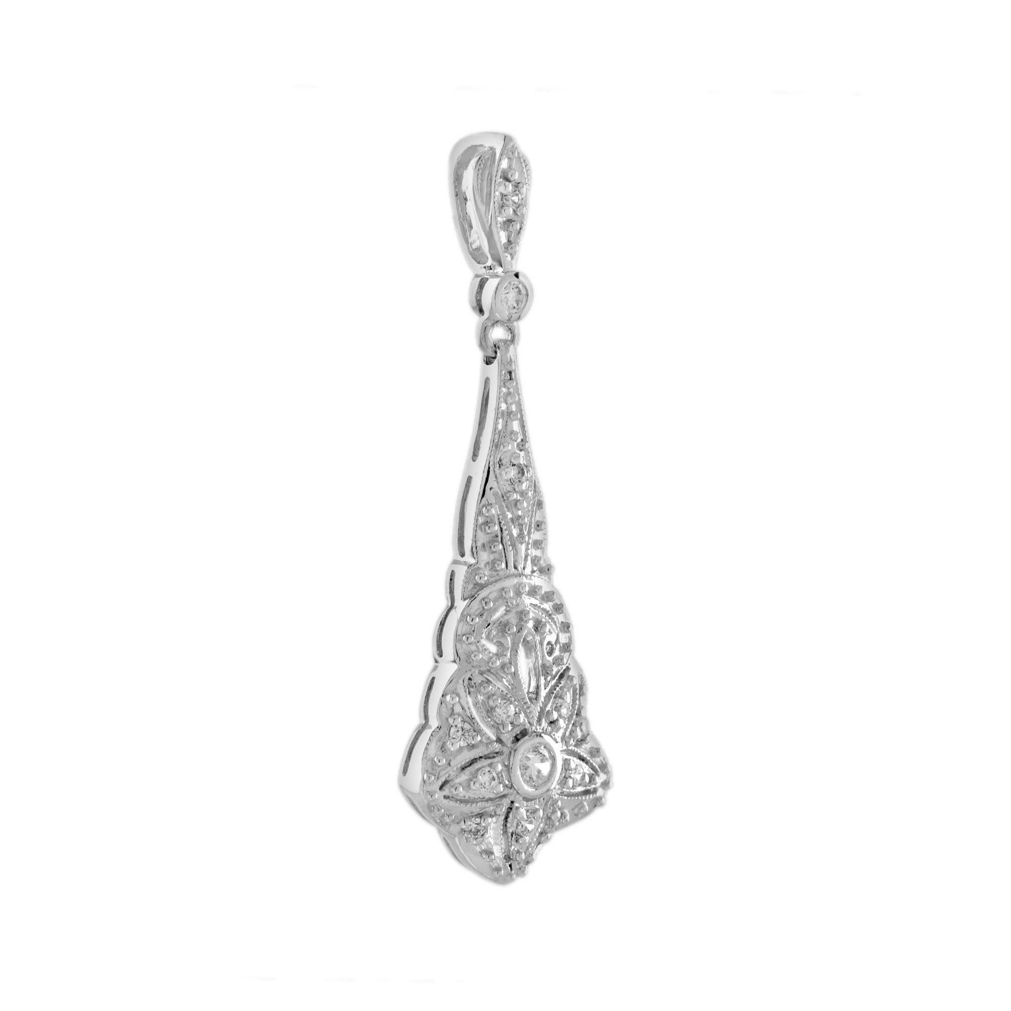 This white gold Art Deco inspired pendant preserves in its lozenge outline a five petals flower with a round cut diamond as its heart. This joyful jewel encrusted with a total of 0.17 carat diamonds dangles from a suspension, which completes its