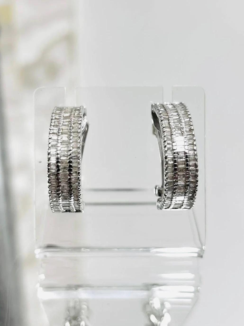 Diamond Baguette & 18k White Gold Earrings

Vintage earrings with triple rows of diamonds in huggie style. Approx 2cts of brilliant white diamonds. For pieced ears with clip over back and butterflies closure.

Additional information:
Size – One