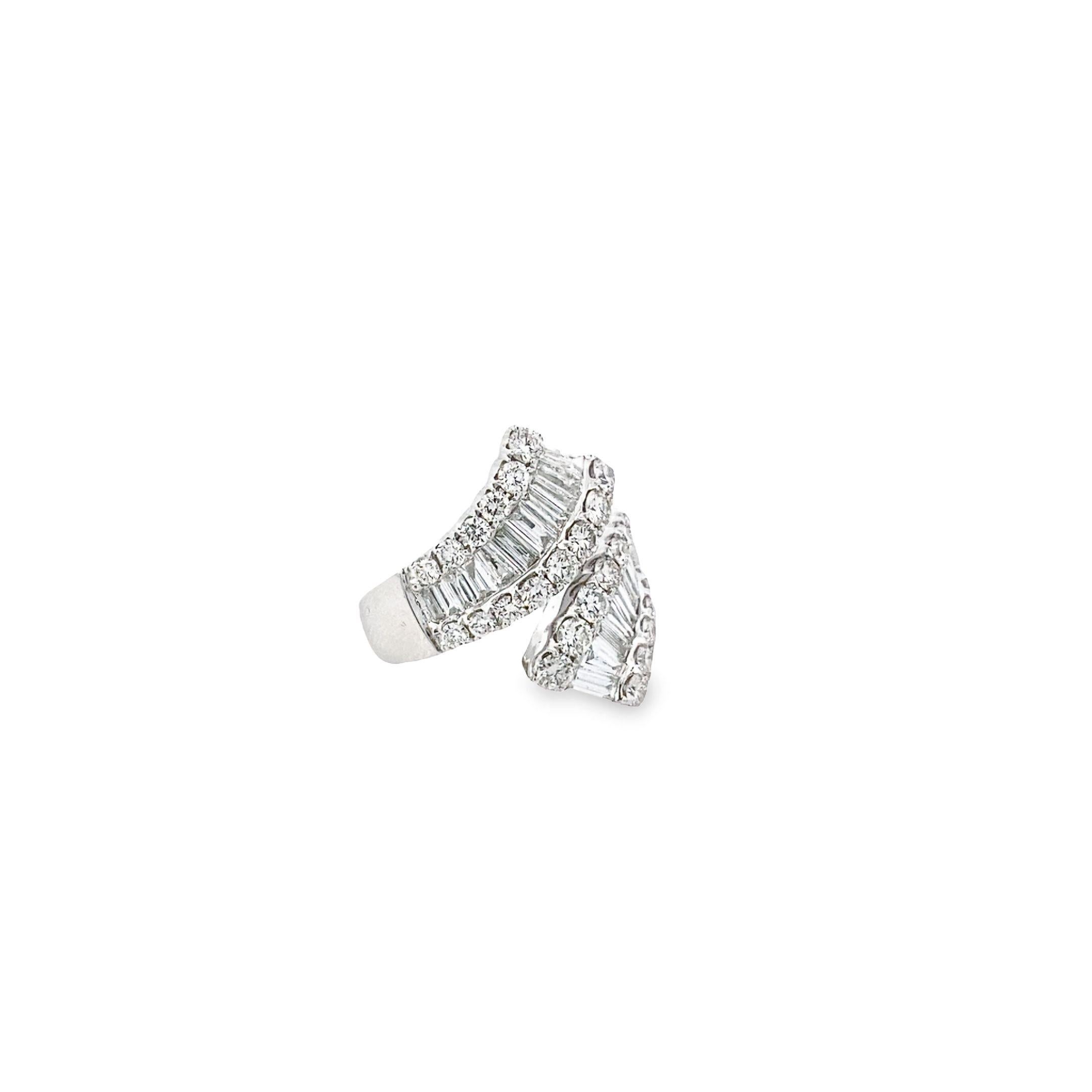 Elevate your style with this sophisticated 18k white gold ring, showcasing a captivating mosaic design. This ring has a 1.45-carat round diamonds in a prong setting, and 1.38 carats of sparkling channel-set baguette diamonds. Together, these