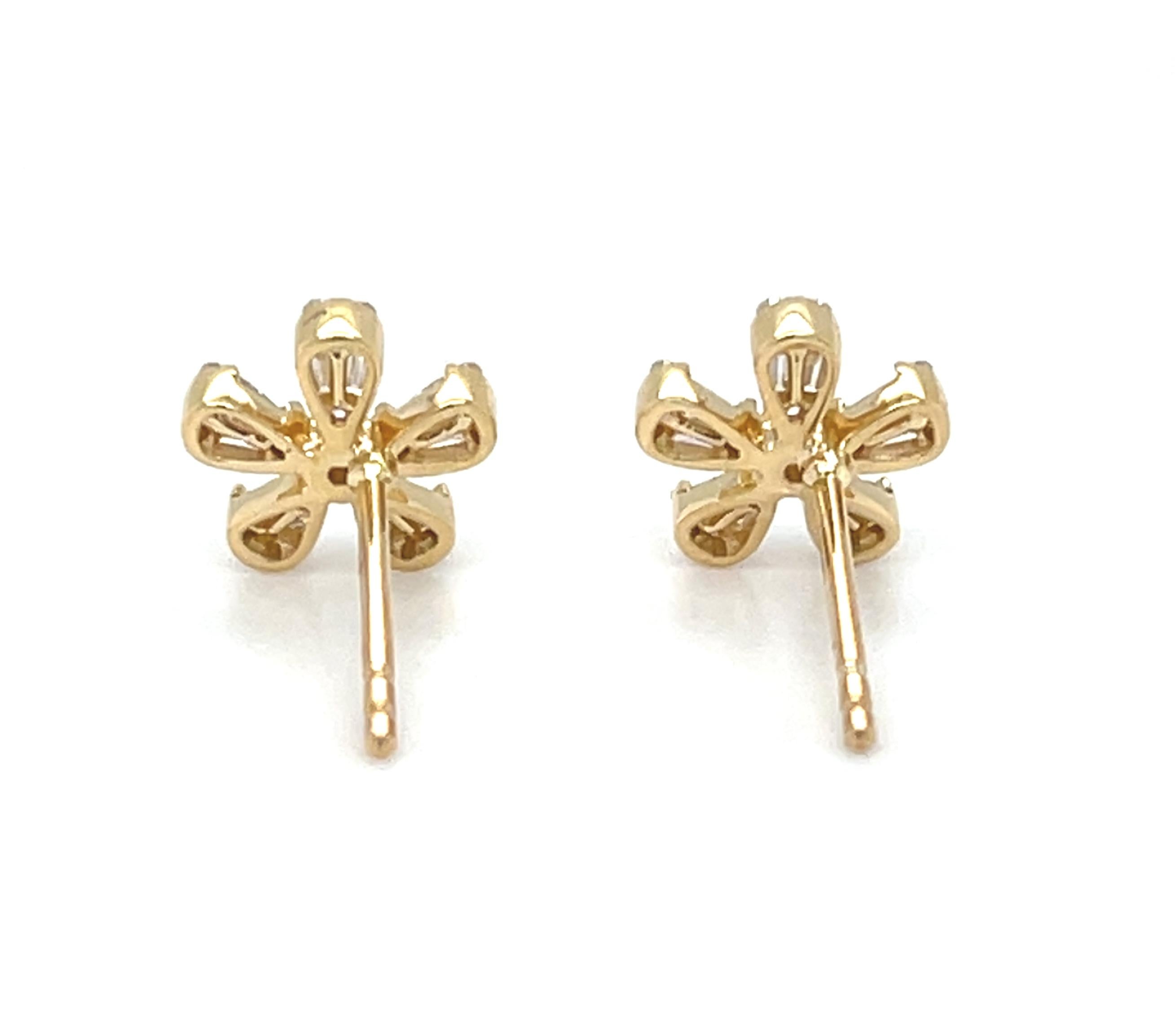 These pretty diamond earrings are a perfect way to make any day feel like a special occasion! Featuring sparkling brilliant and baguette cut diamonds set in a lovely floral design. They are crafted from 18k yellow gold. What a delightful way to