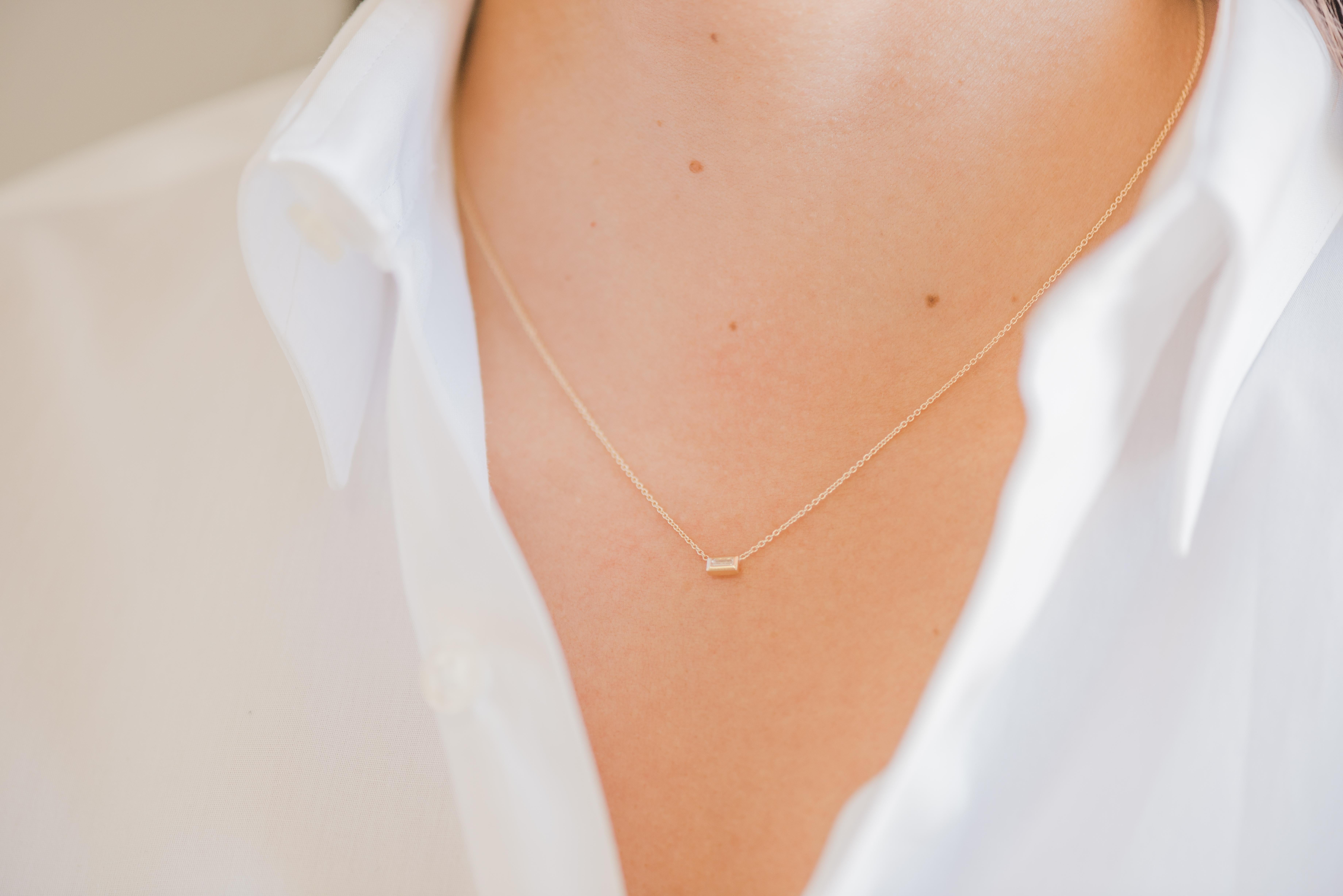 Beautifully handcrafted baguette single bezel diamond in 14k solid gold hanging from a dainty cable link chain. Chic and timeless, wear it by itself or layered, day or night. 

Made in L.A.

Length: 16