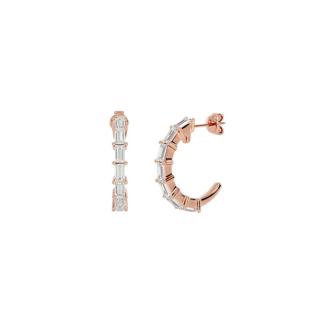 Add glitz and glam to your look with our one-line diamond baguette open huggie hoops. These earrings are finished with 0.27 ct. baguette diamonds set in 18k gold and weigh 1.73 grams. Dressed up or down, these stunning earrings are the perfect