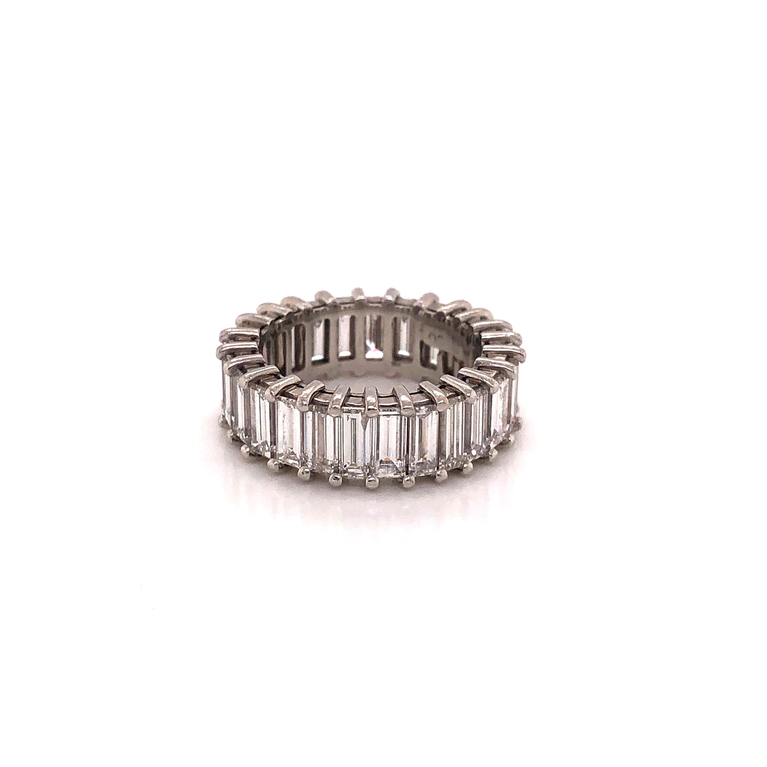 Amazing design on this platinum eternity band. All natural baguette diamonds were sourced to create this one of a kind look. These elongated baguette diamonds are all VS quality and white in color. Each diamond in this ring weighs approximately .25