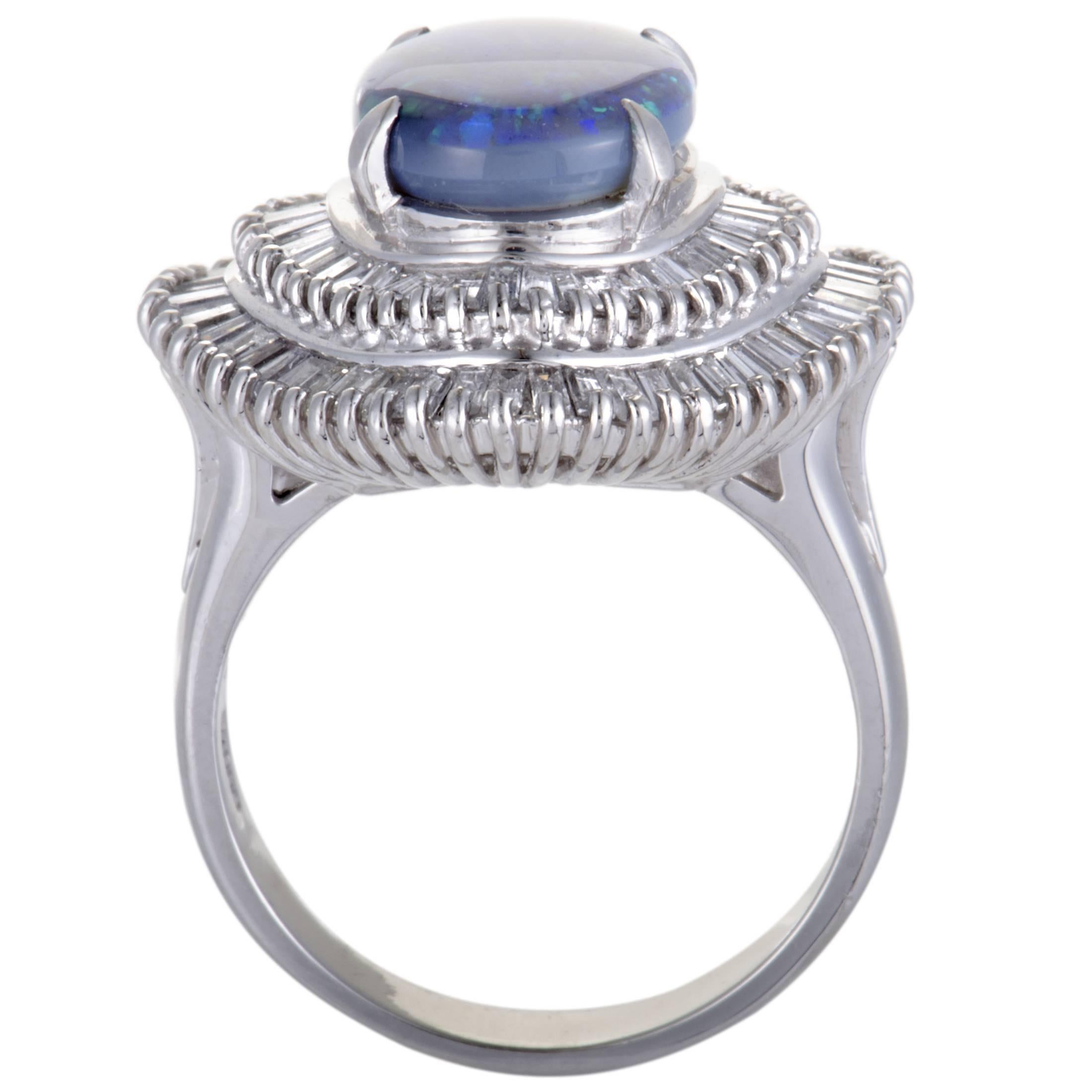 This extravagant ring features a sensationally alluring style. The gorgeous ring has a stunning micropave of dazzling 1.30ct diamonds surrounding a mesmerizing blue opal stone of 2.30ct that makes it a perfect accessory for a special occasion.
Ring